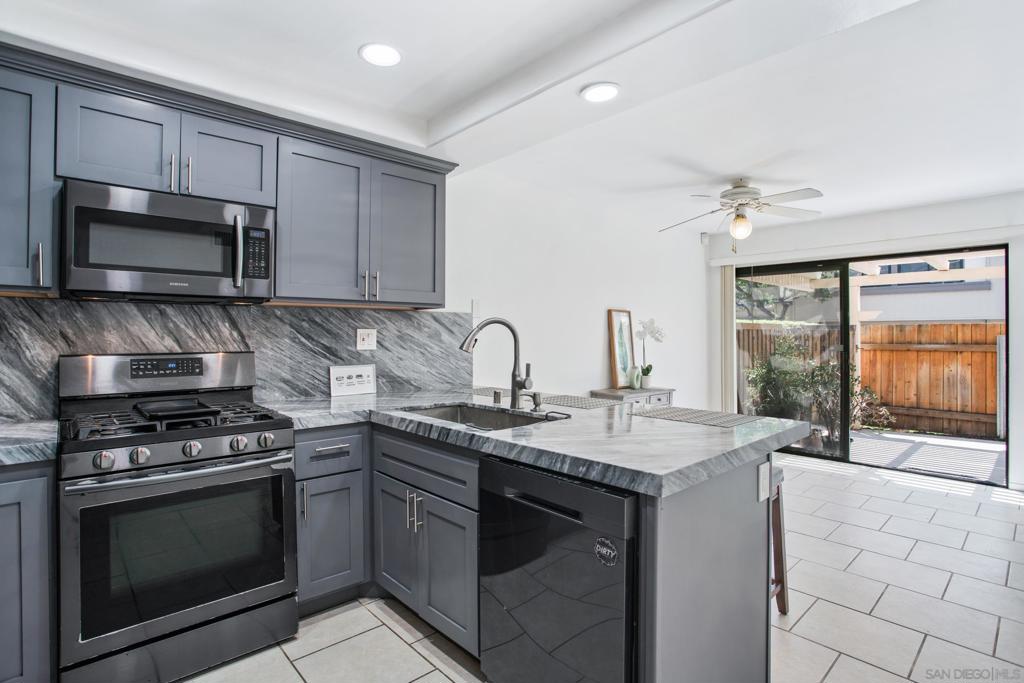 Welcome to Villa Monterey, a peaceful Tierrasanta community offering comfort, convenience, and resort-style amenities. This desirable end-unit townhome features two bedrooms, two full bathrooms, and a powder room on the main level — with a functional layout designed for everyday living or investment potential. The kitchen has been remodeled with granite countertops, Samsung stainless steel appliances, and sleek cabinetry, combining modern style with functionality. Sliding doors open to a private, low-maintenance patio perfect for dining or relaxing outdoors. Recent upgrades include a centralized AC unit for year-round comfort, as well as an updated electrical panel with all new circuit breakers — ensuring both efficiency and peace of mind. Additional highlights include an interior laundry area and an attached two-car garage. Residents of Villa Monterey enjoy access to two pools, a spa, tennis courts, and a clubhouse. The community is ideally located near top-rated schools with quick access to the 15 and 52 freeways, all within one of Tierrasanta’s most sought-after neighborhoods.