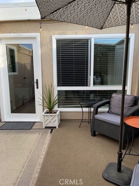 Turnkey Arbor Gated community - 1 Bedroom, 1 Bath unit has an updated kitchen with newer cabinets, grey colored quartz and glass backsplash. Newer stainless steel appliances, laminate flooring through out, newer bathroom vanity with quartz counter top. Newer double pane windows, washer and dryer. Ceiling fans keep the home cool. Primary bedroom has a nice walk-in closet. HOA pays for the water and trash. Community offers pool & spa. 57/91 freeway close & close to CSUF.