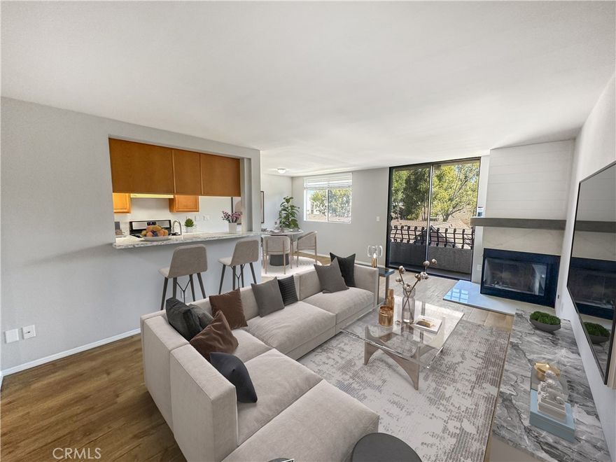 Welcome to your airy, top-floor corner condo, one of the community’s most sought-after layouts with two suites floorplans for comfort and privacy. Perched on the 3rd floor, this end unit enjoys sweeping views, refreshing cross-breezes, and a relaxing balcony right off the living room. Upgrades include: Pergo flooring throughout; a refreshed kitchen, dishwasher, wine/beverage refrigerator, quartz countertops, and a stainless sink with a sleek modern faucet. The kitchen’s generous prep space makes cooking and entertaining a joy. In the living room, cozy evenings await by the fireplace. Both bedrooms feature mirrored wardrobe closets, with the expansive primary offering extended mirrored closet space for extra storage. Comes with side-by-side laundry and two side-by-side assigned parking spaces with gated and secured access. Located in North San Pedro, you’re within walking distance to shopping, dining, and parks and less than 5 miles to the beach.