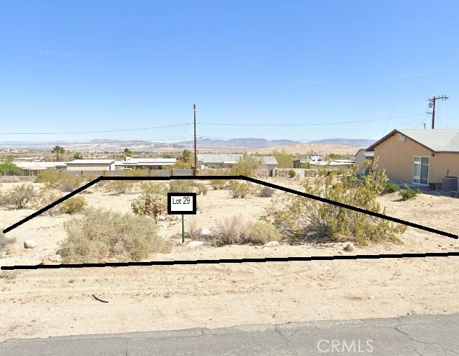 Discover Your Desert Oasis in 29 Palms.
Nestled on over a quarter-acre in a tranquil, sought-after neighborhood, this rare lot offers panoramic mountain and valley vistas. Zoned Residential (4 units/acre), it accommodates a custom stick-built home or manufactured dwelling plus an attached or detached ADU—ideal for guests, rental income, or multi-generational living.
Key Features:
• Lot Size: 0.28+ acres—ample room for home, ADU, landscaping, and outdoor entertaining
• Utilities in Place: Power on north boundary; water stubbed on south (meter install pending); Spectrum cable/internet at rear poles
• Zoning Flexibility: Build a single-family residence with one ADU for extra living space or passive income
• Scenic Views: Unobstructed panoramas of the Little San Bernardino Mountains and expansive desert valley
Cultural & Historical Significance:
The name “Twentynine Palms” honors the Serrano people, original stewards of the Oasis of Mara nearby. Legend holds they planted 29 palms for each boy born to the tribe, giving the city its evocative name and a profound connection to the land.
Location Advantages
• Joshua Tree National Park: East entrance mere minutes away; 3 million annual visitors; five annual fee-waived days for residents and friends
• Tortoise Rock Casino: Entertainment and dining less than a 10-minute drive
• Daily Conveniences: Grocery stores, cafes, and restaurants all within a short drive
• Education: Local schools are easily accessible for families
• Military Community: Proximity to Marine Corps Air Ground Combat Center—America’s largest Marine Corps base—adds stability and community vibrancy.
Why You’ll Love It:
Imagine sunrise hikes beneath the palms, starlit nights unmarred by light pollution, and weekends exploring iconic rock formations. Whether you’re seeking a full-time desert retreat, a vacation rental, or a family homestead, this lot is your blank canvas for desert living at its finest
ROI & Appreciation:
Desert properties near national parks often outpace regional averages, driven by rising ecotourism and remote-work migration.