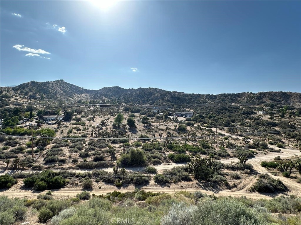 Discover the perfect opportunity to build, expand, or escape on this beautiful 4.96-acre parcel in scenic Pinon Hills. Soak in breathtaking panoramic views of the San Gabriel Mountains and wide-open desert skies. This mostly usable land invites you to design your custom home, establish a private ranch, or cultivate your own high-desert retreat. Embrace the freedom to roam, ride, grow, and create in a peaceful setting with plenty of space for horses, off-road vehicles, or agriculture. Conveniently located just off Highway 138, with nearby access to schools, shopping, and daily essentials. Power is nearby—buyer to investigate all utilities, zoning, and development possibilities. Don’t miss your chance to claim a piece of the quiet and beautiful high desert lifestyle.