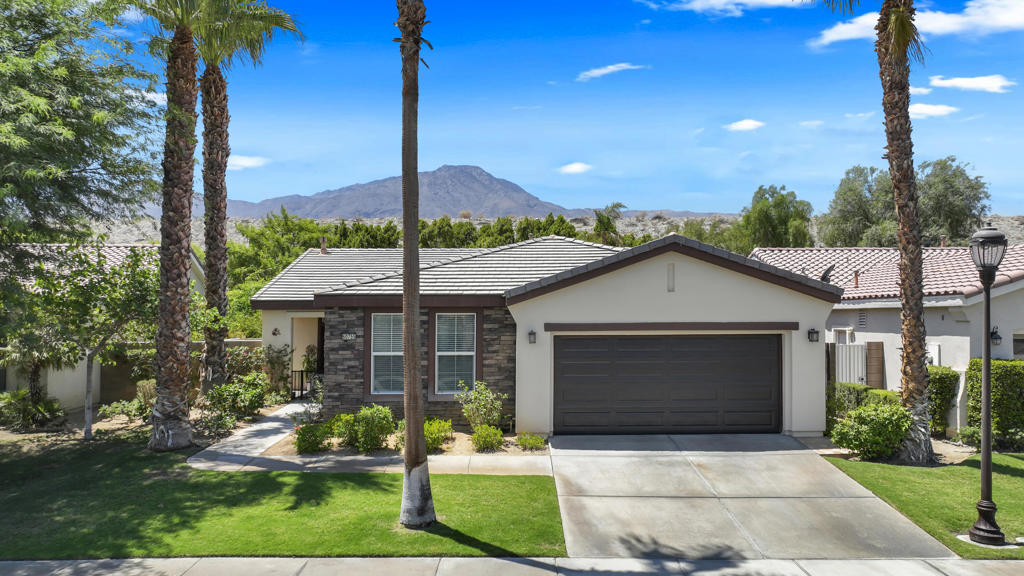 Experience resort-style living in this beautifully maintained home within Trilogy at La Quinta. The open-concept floor plan is filled with natural light, enhanced by bay windows overlooking the private backyard retreat. A stone-accented fireplace anchors the main living area, adding warmth and character to the bright, open design. Step outside to enjoy the covered patio and salt-water pool/spa combination, recently resurfaced with a stunning blue pebble finish. Both pool pumps have been replaced within the last year, ensuring worry-free enjoyment of this private oasis.The lush backyard also features a new irrigation system, creating a true retreat setting. Inside, consistent tile flooring flows throughout, complemented by thoughtful upgrades including a new HVAC, AC, tankless water heater, new dishwasher, and ceiling fans in the master bedroom and dining room. The kitchen is enhanced with reverse osmosis filtration (Culligan service also available), while the garage offers a new door and existing ductwork and vents for future AC connection. A side yard with low-maintenance forever grass provides an ideal space for pets.Life at Trilogy offers more than just a home--it is a vibrant, active community. Residents enjoy the 21,000 sq. ft. Santa Rosa Club featuring craft and hobby studios, a grand ballroom, library, billiards, and table tennis. Amenities include Cafe Solaz, lighted tennis courts, pickleball, bocce ball, a horseshoe pit, two additional community pools, a hot tub, and a well-equipped fitness center. The Coral Spa offers full-service treatments, while the Coral Mountain Club provides creative arts studios, a theater, and social gathering spaces. All this surrounded by the renovated golf course at the base of the breathtaking Santa Rosa Mountains accentuated by beautiful lakesDining is also part of the lifestyle, with Kitchen Ten Eleven, a contemporary California-inspired restaurant, serving made-from-scratch dishes in a stylish yet relaxed setting accented by mid-century modern design.