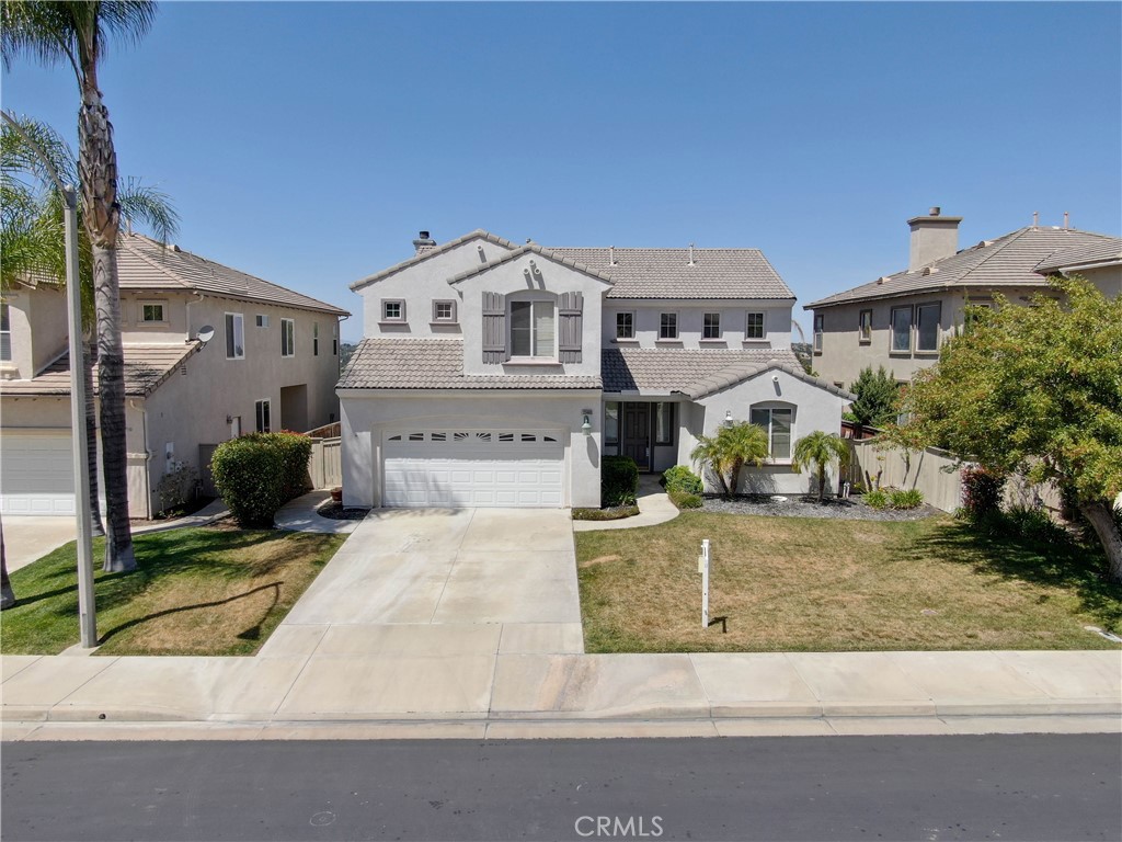 This view lot is located in the beautiful, gated community of Vintage in Redhawk. It has an incredible layout with both a downstairs bedroom and an office that could easily be a 5th bedroom with a bathroom—Neutral paint and ceiling fans throughout the house. The formal living room has an open vaulted ceiling with lots of great natural light. The kitchen has all the amenities you are looking for including granite counters, tile backsplash, an island with both barstool seating and storage, black appliances, a double oven, cupboard pullouts, and a huge walk-in pantry. Dine in the eating area of the kitchen, or the formal dining room. Relax in the inviting family room that opens to the kitchen with a fireplace with granite detail, a built-in media unit, and surround sound. Upstairs you will find 3 more bedrooms plus a loft that makes the perfect space, a playroom, exercise room, etc. Enjoy the phenomenal views from the master suite that includes 2 walk-in closets, dual sinks, and a separate tub and shower. Relax in the backyard under the fan of the patio cover, with panoramic views of the beautiful sunset while laying in one of the largest jacuzzi spa's this home is it, such as while facing the extraordinary view of Temecula Valley and Big Bear Mountain. Walking distance from the HIGHLY recognized Tony Tobin Elementary and Vail Ranch Middle and Great Oaks High School. Convenient to shopping/restaurants/Winery.