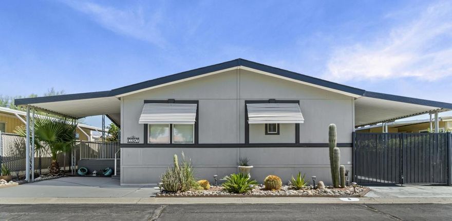 Beautifully Upgraded, Turn Key, fully furnished 3-Bedroom Home in a 55+ Gated Community This charming 3-bedroom, 2-bath home is centrally located within a secure, gated 55+ community and boasts a unique blend of comfort, style, and convenience. Thoughtfully upgraded with quartz countertops in both the kitchen and bathrooms, the home showcases true pride of ownership with tasteful decor, modern updates, and meticulous upkeep throughout. Enjoy added privacy with a gated carport, a handy storage shed, and mature fruit trees. The newly redone deck offers a peaceful view of the park directly across the street -- the perfect spot to relax and unwind. Just steps away from the community park is the clubhouse, where you'll find a variety of amenities including three swimming pools, indoor and outdoor spas, a library, pool tables, and more. One of the most convenient features of this home is its location -- you can walk to the nearby grocery store without even crossing a main road. With easy access to the freeway and just minutes from Palm Springs Airport via Gene Autry Trail, getting around is a breeze. This home is on a permanent foundation and is eligible for all types of financing. Plus, the low HOA fees make it even more attractive. Come see this beautiful home in person -- it's a must-see!