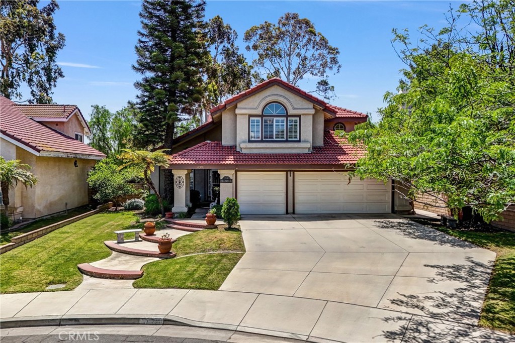VA ASSUMABLE LOAN at 2.750% - these opportunities do not come up often! This gorgeously remodeled pool home in the prestigious Lake Hills neighborhood sits at the end of a cul-de-sac and has paid off solar complete with 40 panels! This one of a kind property boasts 2,840 sq ft of living space with 4 bedrooms plus an oversized loft and 3 full bathrooms. Entering the home you are greeted into the main living room that opens to the dining room where you have a large slider leading off to the back patio. As you pass through to the separate family den it flows right into the fully remodeled kitchen with refinished cabinetry and Quartz counter tops that are accented by a beautiful subway tile backsplash. The kitchen is fully equipped with a new double oven and sink with faucet. Downstairs you have one bedroom and a tastefully remodeled bathroom and also your laundry room with a door leading to your backyard. Upstairs your oversized primary bedroom has soaring vaulted ceilings and two separate closet spaces for ample storage needs. There are an additional 3 bedrooms upstairs and a large loft that has a large set of built in shelves and desk currently set up as an office and could easily be converted into a 5th bedroom. The backyard on this home is the perfect setting for entertaining or relaxing in the pool as your backyard is nestled up against a serene lush strip of trees and shrubs providing ample privacy. Garage is also set up with car charging capabilities. Your dream home has finally arrived!