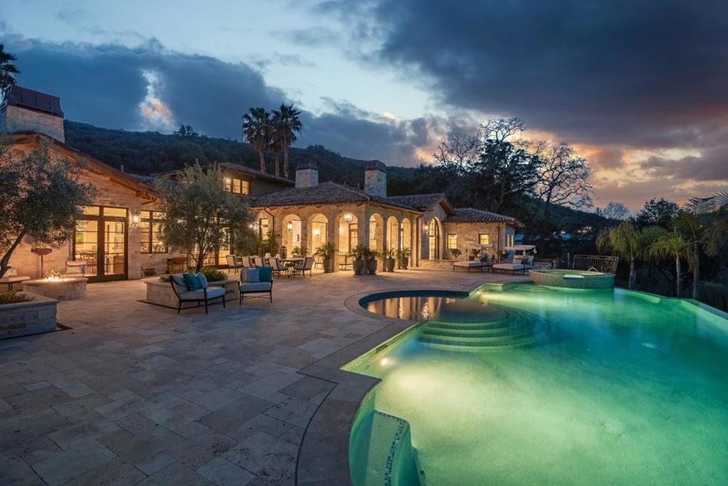 This one-of-a-kind Tuscany-inspired Equestrian & Vintner estate situated on a scenic 20+ acres in the beautiful Saratoga foothills. Transcend from the hustle of Silicon Valley to a place of total tranquility. The property includes: *7,504 sf Main house w/4 bd, 5 bath,1.5 bath & 3-car garage. *512 sf caretakers house w/1 bd, 1 bath & 816 sf 2-car garage w/charging station. *1653 sf, 2bd, 2.5ba groomsman cottage / kitchen & garage. *976 sf, 1bd, 1ba guest cottage w/ kitchen. *State-of-the-art, air conditioned 3366 sf, 8 stall barn with second-floor mountain view office & bathroom. *Two additional outdoor horse stalls. 25,125 sf arena. The Main House is elegant and welcoming with captivating views from almost every room, integrating the home with its gorgeous outdoor environment. The grounds are gorgeous, playful & strike a great balance of business w/pleasure. The spectacular setting affords you privacy & serenity yet is only minutes to downtown Saratoga. Distinguished Saratoga schools