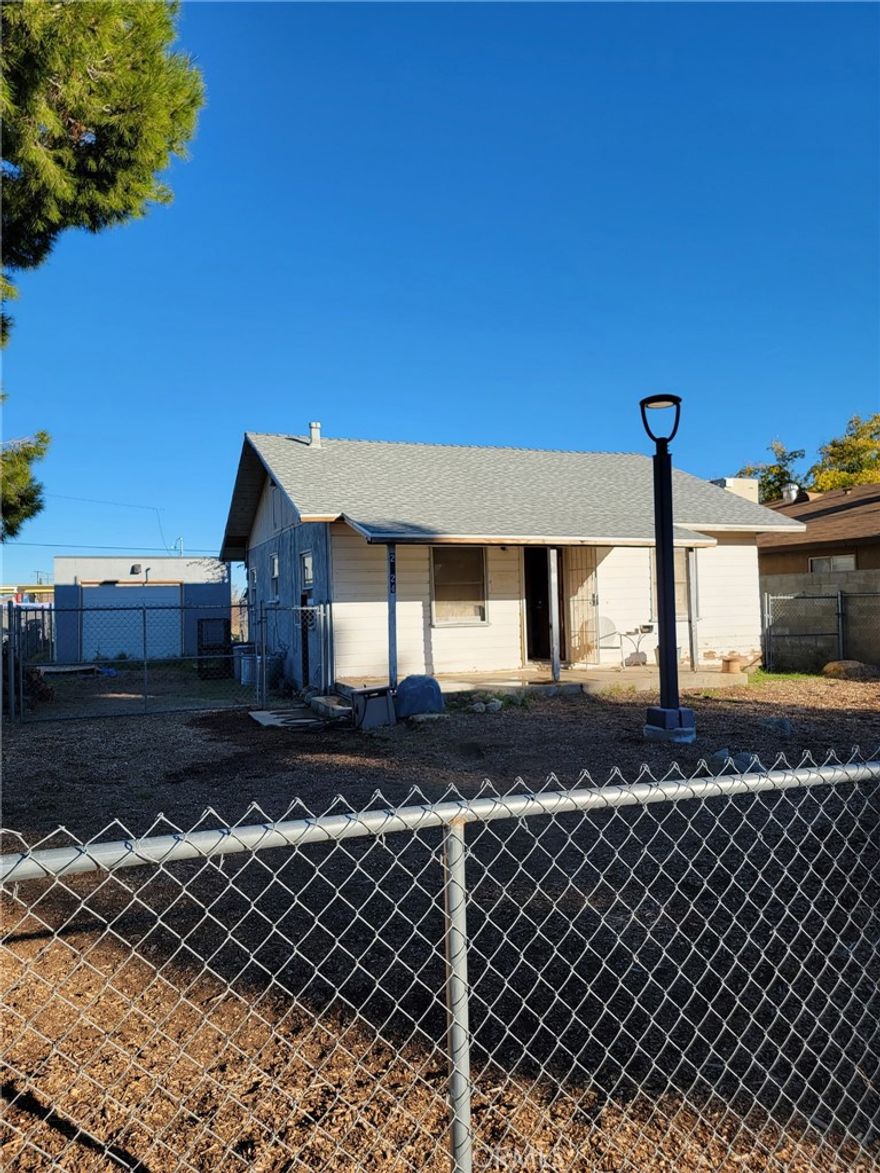 Investment Potential!   3 bedroom 1 bath home on a large 8,010 SF Lot Zoned R-2. Newer roof on both the house and the garage.  Additional Dwelling Unit Potential.