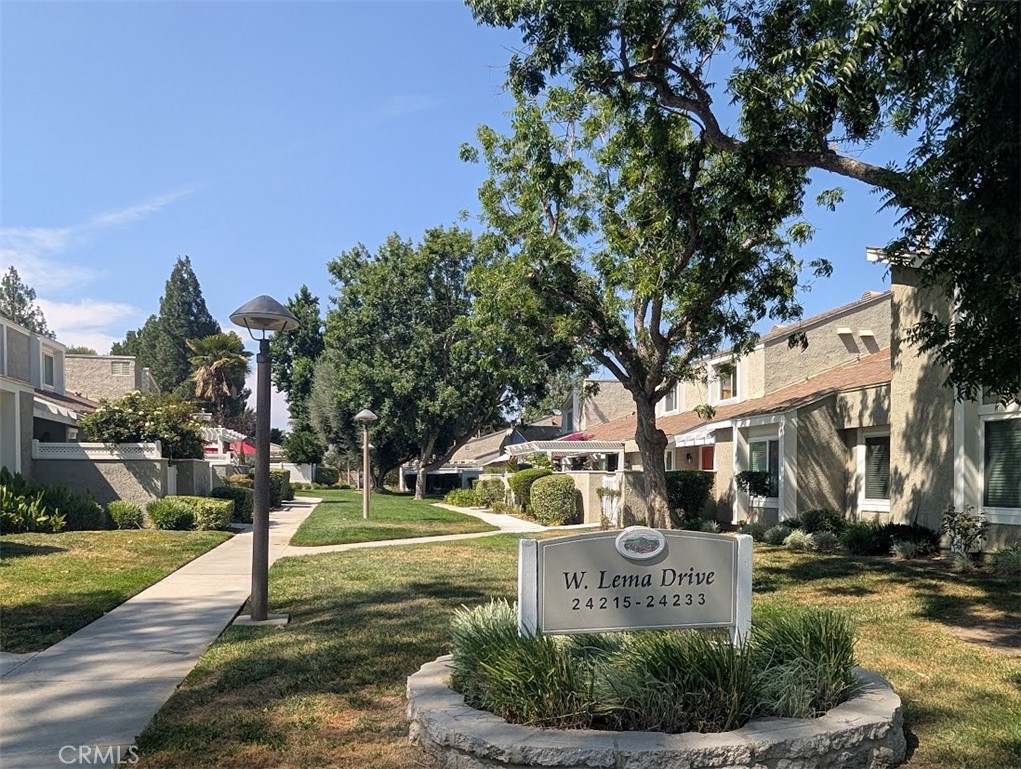 Welcome to 24223 Lema Drive #36, Valencia, CA 91355! This beautifully updated 4-bedroom, 2-bath home offers just under 1,500 sq. ft. of comfortable living space with a highly desirable layout—two bedrooms downstairs and two upstairs. The spacious, tastefully remodeled kitchen features quartz countertops, a subway tile backsplash, and stainless steel appliances, and flows into a generous dining area perfect for family meals or entertaining guests. The oversized living room boasts soaring ceilings and a cozy fireplace, creating a warm and inviting atmosphere.
Both bathrooms have been thoughtfully updated with modern finishes. Step outside to enjoy a large wraparound enclosed patio, ideal for relaxing or hosting gatherings. An oversized, direct-access garage provides ample storage. Located in the sought-after Valencia Fairways East community, you’ll enjoy access to pools and sport courts, plus a prime location near golf, scenic paseo trails, shopping, dining, and more. Come see why this is the perfect place to call home!