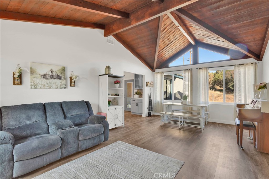 Beautifully Remodeled Home on 2.5 Acres in Oak Hills
Step into comfort and space in this 4-bedroom, 3-bath home on the desirable west side of Oak Hills. Spanning 2,247 sq ft, this fully remodeled residence boasts an open, airy layout filled with natural light from brand-new windows. The bright interior features stylish hard laminate flooring throughout, a sleek galley-style kitchen, and spacious living areas perfect for entertaining or relaxing.
The inviting family room with warm wood ceilings creates a cozy spot to enjoy your mornings or unwind in the evening. Retreat to the expansive primary suite, complete with a walk-in closet and a beautifully updated en-suite bath.
Energy efficiency meets modern living with leased solar panels that help reduce utility costs, along with a tankless water heater and a new roof Set on 2.5 usable acres, there's plenty of room for animals, outdoor recreation, or simply enjoying the peace and privacy of wide-open space. Just minutes from the 15 freeway, you're conveniently connected to the Cajon Pass, shopping, and dining, while still enjoying a tranquil retreat from the bustle.
Don’t miss the opportunity to make this spacious and stylish Oak Hills gem your home!