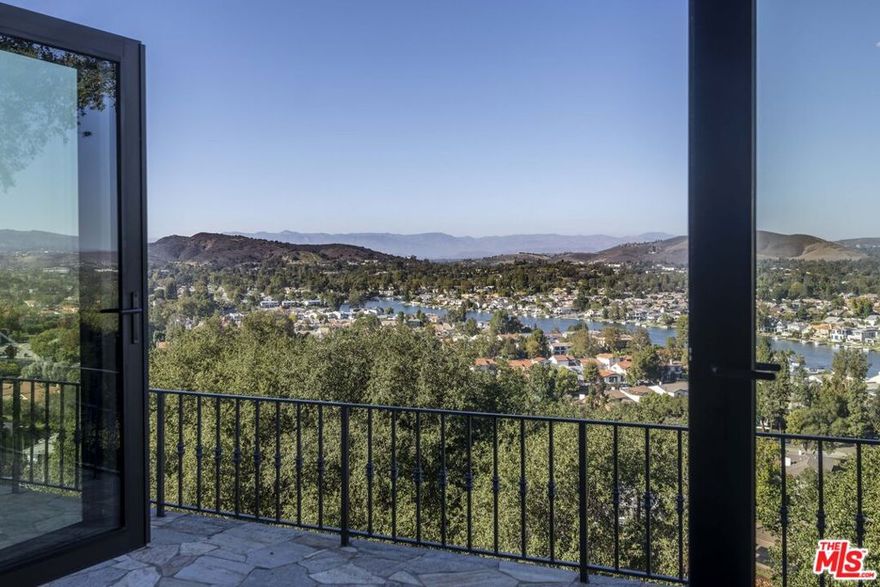 VIEWS VIEWS VIEWS! Experience unparalleled luxury in this exceptional Westlake home, situated on a serene cul-de-sac and perched on a promontory that offers breathtaking, unobstructed views. This captivating property is designed for those who appreciate elegance and modern living  and desire one of the best views in Westlake!As you enter, you are welcomed by a chef's kitchen featuring a Wolf range, large quartz countertops, and a Sub Zero wine fridge, creating an ideal space for culinary enthusiasts. The warm tones of stone and marble flooring flow seamlessly throughout the home, enhanced by beautiful chandeliers and updated lighting fixtures. Retreat to the primary suite, a true sanctuary, featuring a recently reimagined bath with a spacious glass and stone shower, along with expansive his-and-her walk-in closets that provide ample storage. Recent upgrades ensure modern comfort and efficiency, including a Radiant Life filtration system, reverse osmosis water system, new HVAC, and tankless water heaters. The property also boasts updated plumbing and electrical systems, dual-zone A/C condensers, and enhanced lighting throughout. This exquisite residence perfectly blends breathtaking views with luxurious amenities, making it an extraordinary find in Westlake. Don't miss the opportunity to call it home!