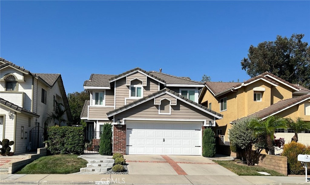 Very Elegantly upgraded, This 3 bedroom 2.5 bathroom Chino Hills home shows sharp and beautiful! Wonderful curb appeal as you arrive with a very tasteful exterior and gated courtyard entry. Amazing floor plan flows nicely. Formal entry with family room situated to one side with a nice size and formal living room the other. All downstairs with beautiful laminate floors and upstairs with very nice carpet. Kitchen has been upgraded and new cabinetry, new Quartz tops and stainless appliances. Formal living room has high ceiling, nice fire place. New windows, new sliders and plantation style shutters are wonderful new features of this property. Master bedroom has private en suite bathroom with has been remodeled, new counter tops and oversized large walk in shower with neutral toned tile. Convenient indor laundry room. Upgraded ceiling fans in all rooms. Very nice back yard for entertaning. Home is situaded to nearby shopping, 71 freeway, and very nice parks.