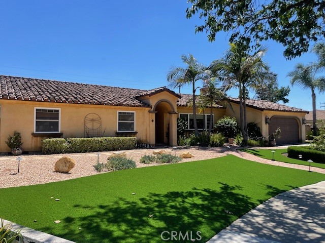 Beautiful Custom California Spanish Mission Style Home. Extensive New Landscaping with Putting Green and Mature plants. Fabulous high end
Gourmet Kitchen with Custom Wood Cabinetry, Granite Counters, Viking Premium Appliances, Double ovens, Fridge, Wine Fridge, and Massive Gas Stove top. Glass Door to side yard off Kitchen. Travertine and refinished Wood floors throughout the home. Entry with Custom Mission Style Wood Door and Mosaic tile Entry. Open Beam Ceilings. Custom Spanish Tile Roof. Entertainers Backyard with Pool and Spa, built-in Water Slide with Rocks and all Custom Decking. Covered Patio and Large Cabana with cover. Lots of Counter Space with Viking BBQ, Viking Wok Burner and Fridge. Entertaining area off Kitchen with room for a large harvest table and Family Room with Spanish Style Fireplace. Doors to Patio and Pool/Cabana Views off Kitchen. Large living room with Spacious Fireplace and Wood Floors. Separate Hallway with Three Bedrooms and Two Baths with a Third Bath Powder Room. Separate Laundry room off Kitchen. Two Car Garage. This is a Beautiful Property!