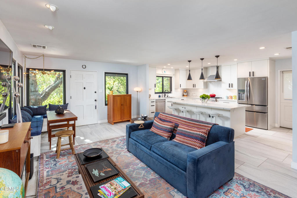 Tucked away in the serene San Rafael Hills of Southwest Pasadena, this enchanting 2-bedroom, 1-bathroom home offers a true escape into nature, while still being just minutes from the vibrant heart of the city. Perched like a treehouse, the property is enveloped by lush greenery and towering old-growth trees, creating an incredibly peaceful, private atmosphere.Entering into the home, the florplan is an open concept creating a large combined space for the living room and kitchen areas. The kitchen has been thoughtfully upgraded with high-end Thermador stainless steel appliances, white subway tile, striking black hardware, a large island and pristine white stone countertops, creating a space that's both functional and visually stunning.The remodeled bathroom features a handsome marbled tile floor, a black lacquer vanity, and a frameless glass shower -- blending modern sophistication with timeless design. Sliding glass doors lead to the private terraced backyard. The large patio area is ideal for entertaining, offering a perfect spot for dining, relaxing, or simply enjoying the tranquil surroundings.This property is located on one of Pasadena's 'Secret Stairs' corridors, the hidden staircases that lace the hillsides of certain L.A. neighborhoods which form a delightful network of urban walking 'trails' that are historical reminders of a time when this was not a city of cars. This home's unique combination of privacy and nature, paired with its convenient location, makes it a rare gem. Experience the best of both worlds: your peaceful, tree-filled retreat in the heart of Southwest Pasadena.Newer dual pane windows!