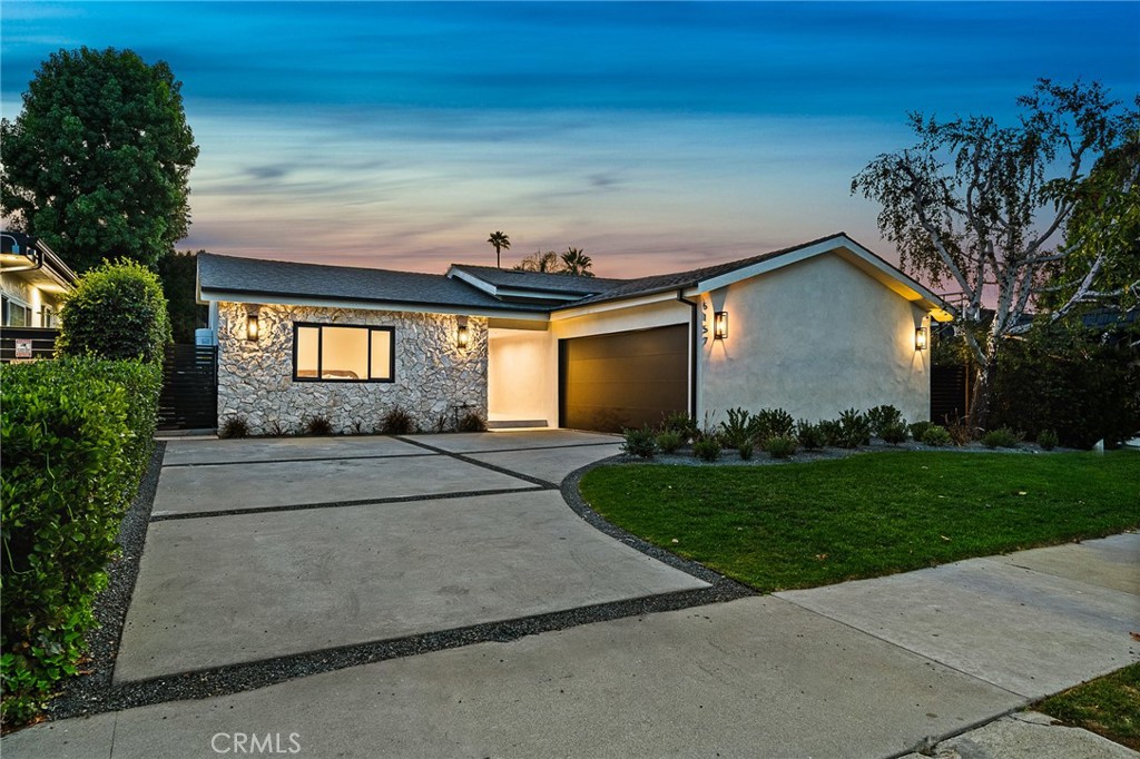 Luxurious reimagined single level home finished with top-tier quality and unique design elements, situated within the coveted Hesby Oaks school district surrounded by multi-million dollar homes. The expansive floor-plan offers 4 bedrooms and 3.5 bathrooms and the home is flooded with tons of natural light. A gourmet Chef's kitchen displaying porcelain countertops and a large center island with breakfast seating flows into the impressive wine display. The luxurious master suite offers a large walk-in closet and spa-like bathroom with double vanity space and walk-in shower. Private yard with ample grassy area, patio dining seating and built-in BBQ area. Additional amenities include surround sound throughout, security cameras, and easy access just minutes from Ventura Blvd and Encino's best schools, shops and restaurants.