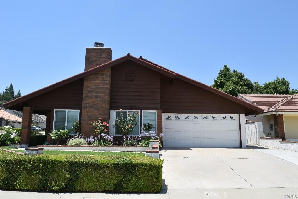 Embrace the charm of a cozy traditional home nestled in the tranquil cul-de-sac of Phillips Ranch! This inviting single-story residence features 4 spacious bedrooms, 2 elegant bathrooms, and a generous 2063 sq ft of living space. Benefit from the exceptional education offered by top-rated schools like Ranch Hills Elementary, Lorbeer Middle, and Diamond Ranch High. Upon entering, you'll be welcomed by a warm and spacious formal living room adorned with high ceilings and a fireplace, perfect for creating a comfortable atmosphere. The separate formal dining room is ideal for hosting intimate gatherings. The family room, adjacent to the kitchen, showcases vaulted ceilings and a ceiling fan, providing a cozy space for relaxation. Each of the 4 well-appointed bedrooms is equipped with ceiling fans, while the entire home is embellished with timeless cherry laminate flooring. The picturesque backyard offers a lush grassy area and an elevated section with a delightful variety of fruit trees, including lemon, peach, persimmon, and more. Explore the extensive walking trails in the Phillips Ranch community and enjoy the convenience of brand new shopping and dining malls nearby. The landlord will provide gardener service at no extra charge, and the home will be available for move-in September 1. Don't miss this incredible opportunity to live in a cozy, traditional home in a sought-after neighborhood!