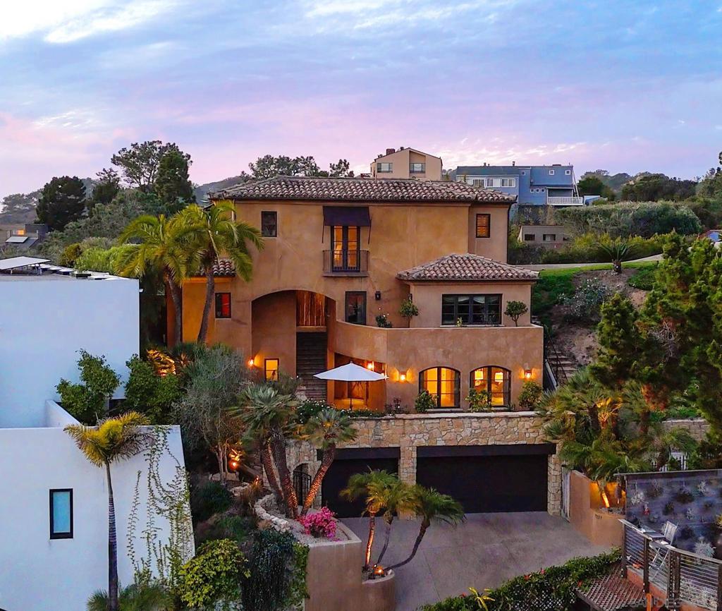 Priced to sell....Tucked into the hills of Del Mar Terrace with views of the Pacific Ocean and the Torrey Pines Reserve is this masterfully built, modern Italian villa. Custom designed and constructed with extraordinary materials and workmanship this home offers privacy and exudes quality. Complete with 4 bedroom suites, each with outdoor access, a sound proof gym, wine cellar, elevator, 3 fireplaces, outdoor spa with ocean view, cook's kitchen, walk- in pantry, primary retreat with 2 walk-in closets, and 3 car garage. Incredible opportunity to live life above the fray! Located minutes to the beaches and California surfing, the Village of Del Mar, hiking and golf at world class Torrey Pines, the Del Mar Race Track, shopping and dining, just 30 minutes to public and private airports, 3 universities and downtown San Diego. The best known secret in Del Mar is the neighborhood of Del Mar Terrace with its viby, eclectic charm offering exclusivity, luxury and privacy, a blend of cutting edge design, panoramic views and a lifestyle and community that values privacy and quiet, but remains close to nightlife, fine dining, entertainment and outdoor endeavors. Nothing compares.