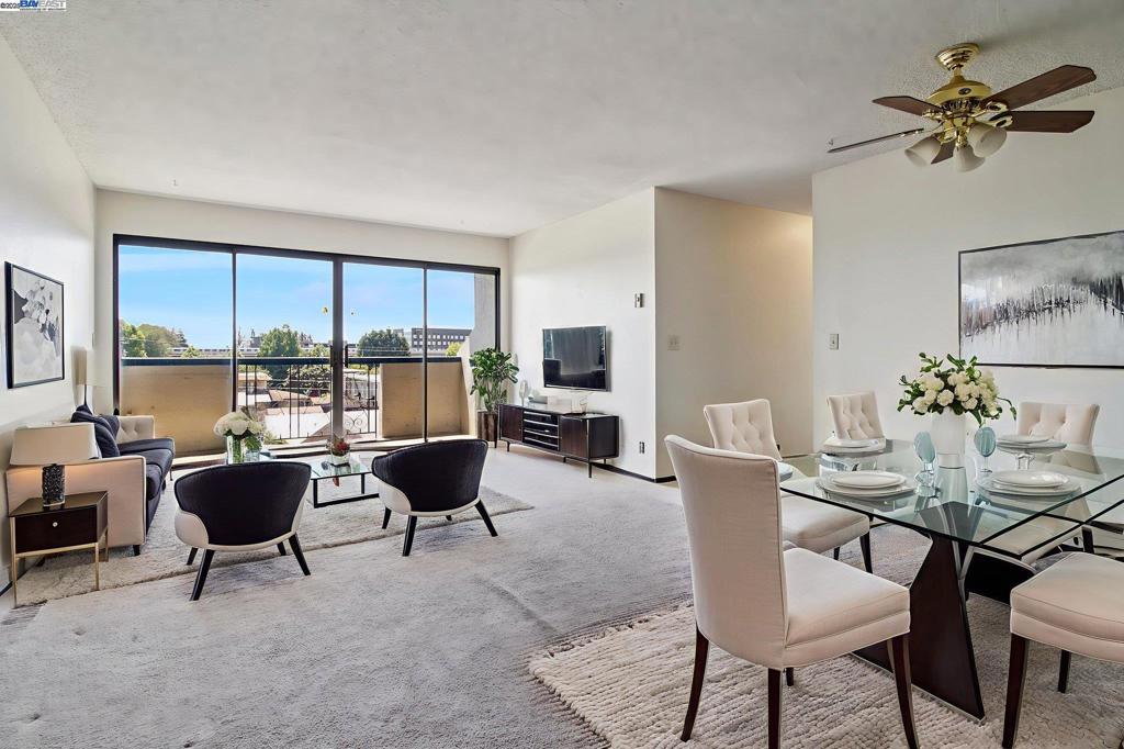 Welcome to move in ready 2-bedroom, 1.5-bathroom condominium offering comfort, convenience, and city living at its best with no rental restrictions. Located in a secured building just steps from BART, restaurants, grocery stores, and shopping, this home places you in the center of everything San Leandro has to offer. Step inside to discover a light-filled interior with fresh paint throughout and a private balcony with amazing views. The large living room and dining area provide an ideal space for entertaining or unwinding after a busy day. The spacious bedrooms offer generous closet space, while the 1.5 bathrooms deliver functionality and flexibility for everyday living. Enjoy the convenience of in-unit laundry, secure parking with extra storage, and peace of mind in a well-maintained, secured community. Whether you're commuting to the city or enjoying the vibrant local scene, this home combines comfort and location in one perfect package. Some photos have been digitally staged.
