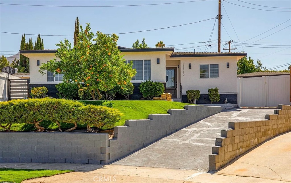 Front home in the heart of Sunland, this beautifully updated 4-bedroom, 3-bathroom residence offers 1,836 square feet of comfortable living space with its own driveway and convenient parking. Inside, you’ll find a spacious living room with recessed lighting and a cozy fireplace, a stunning modern kitchen with updated finishes and ample cabinetry, and the added convenience of an in-unit washer and dryer. Thoughtful upgrades throughout the home create a warm yet contemporary feel, while the private backyard offers the perfect retreat for outdoor dining, entertaining, or simply relaxing. Combining comfort, functionality, and style in a prime location, this home is move-in ready and ideal for modern living. *Landlord will be building adu in the back, discount offered during construction period.*