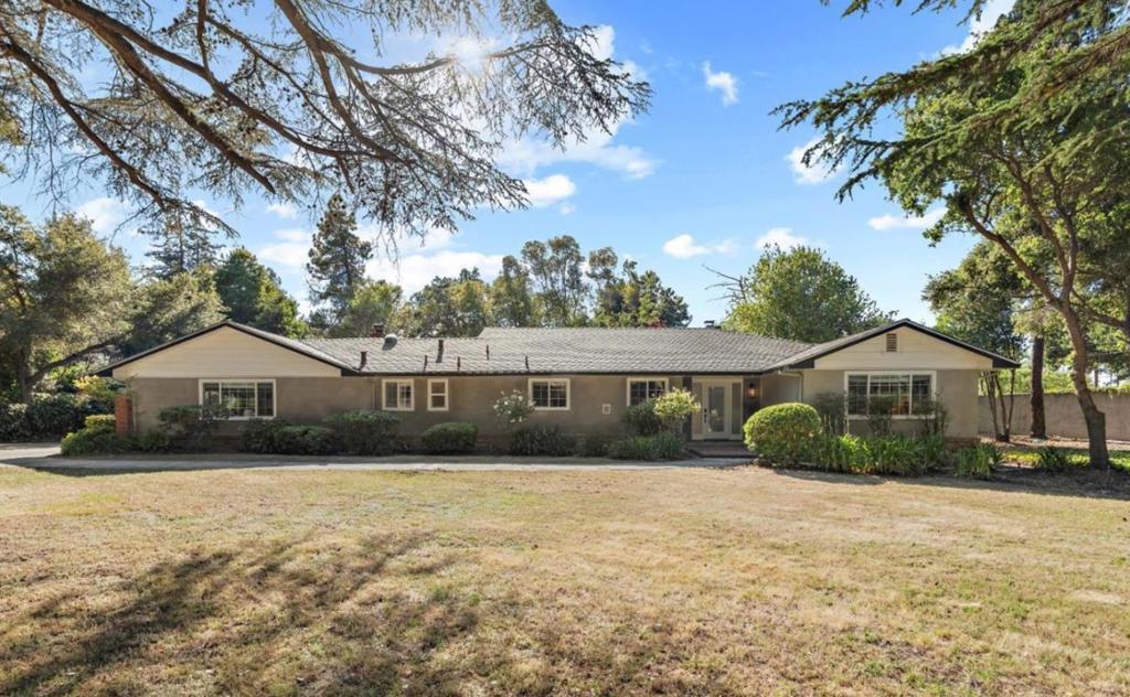 Welcome to this spacious 5-bedroom, 3-bathroom home in the prestigious city of Atherton. This residence offers a generous living space of 3,230 sq ft, perfectly situated on a sizable 52,037 sq ft lot. The kitchen is well-appointed with a gas cooktop, electric oven, refrigerator, microwave, warming drawer, dishwasher, and tile countertops, all enhanced by a skylight that provides natural light. The home features a formal dining room and a separate family room, both ideal for entertaining. Stay comfortable year-round with central forced air - gas heating. Enjoy the convenience of quality laminated and tile flooring throughout, a cozy fireplace, and walk-in closets for ample storage. Separate laundry Room. This property is located within the Menlo Park City Elementary school district. Additional amenities include a two-car garage. This home combines functionality and elegance, making it a perfect choice for your next residence.
