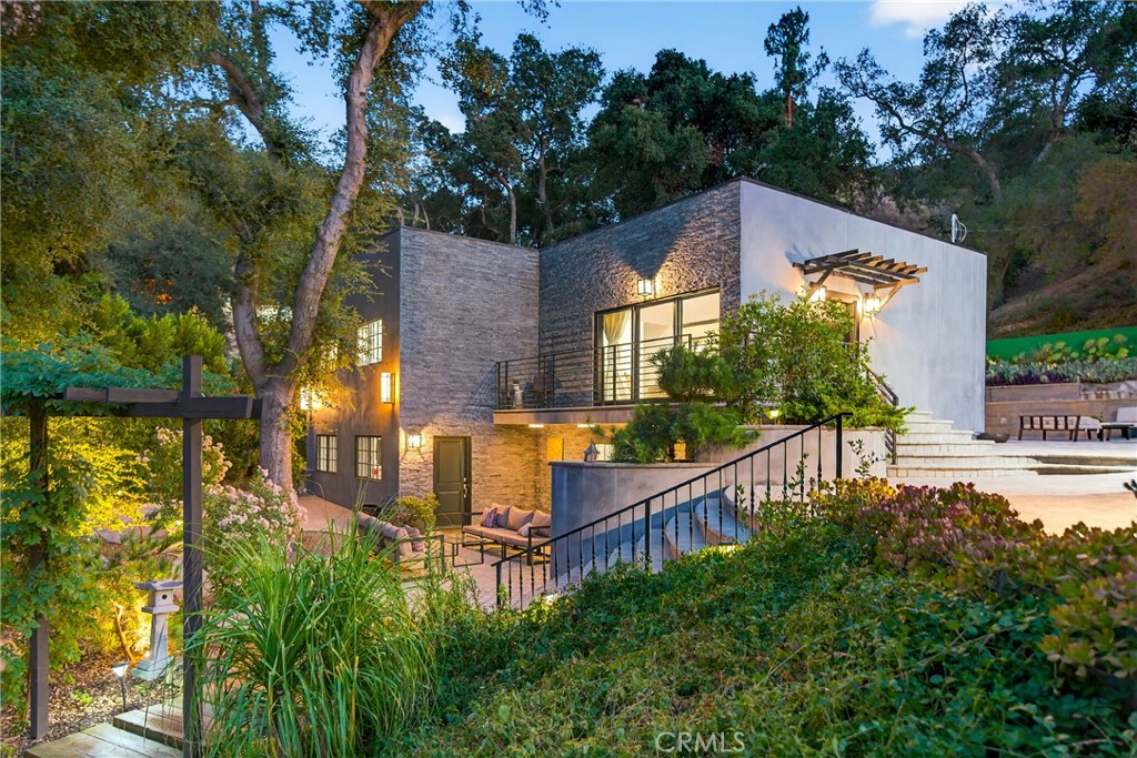 Three Homes on One Estate! 
Set on 4.4 acres of landscaped grounds, this multi-parcel estate blends modern luxury, artistic design, and serene outdoor living. Surrounded by lush gardens, mature oaks, cherry blossoms, and sweeping mountain views, the property provides exceptional privacy and tranquility.
At the center is a Japanese garden by designer Tomoyuki Nakamura, featuring a 12-foot Torii gate, picnic area, and rare imported glass greenhouse. Artistic details include custom faux bois by Terence Eagon, stone hardscaping, and a fully irrigated hillside.
The main residence offers 5 bedrooms and 4 bathrooms, renovated in 2023 with porcelain tile floors, Shoji screen closets, a stone fireplace, and a chef’s kitchen with stainless steel appliances and quartz countertops. Fleetwood sliding doors open to garden-view balconies for seamless indoor-outdoor living.
The second home features 1 bedroom and 2 bathrooms, while the third includes 3 bedrooms and 2 bathrooms—both with flexible living options.
Bordering McGroarty Park with playgrounds and tennis courts, and near the McGroarty Arts Center and Angeles National Golf Club, this rare estate combines comfort, artistry, and natural beauty in a private setting.
APNs are as follows: - 2563-005-005 / 7572 McGroarty - SFR, 2563-005-006 / Vacant Land, 2563-005-007 / 7850 McGroarty - SFR, 2563-005-008 / 7582 McGroarty - SFR