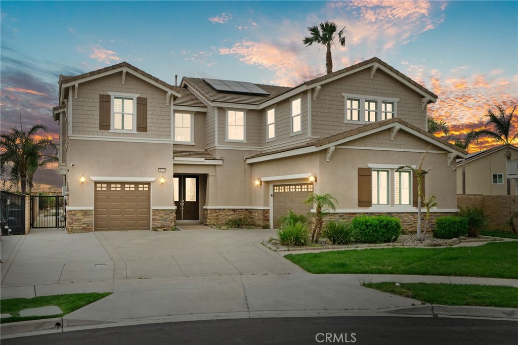 MULTI-GENERATIONAL CUL-DE-SAC POOL HOME ZONED FOR THE ETIWANDA SCHOOL DISTRICT! Step into the pinnacle of modern living with this stunning, energy-efficient masterpiece located in one of the area's most sought-after neighborhoods. Inside, you will find 5 bedrooms and 4.5 baths (1 bedroom and 1.5 baths downstairs), along with numerous upgrades, including a gourmet kitchen equipped with stainless steel appliances, a spacious family room, and formal dining and living areas. The home is beautifully designed with crown molding, plantation shutters, recessed lighting, New paint, New Bathrooms, New Flooring, and PAID OFF SOLAR. Cozy up by the fireplace or step outside to your private backyard oasis, which features a sparkling pool, covered patio, putting green, and surrounded by a block wall for added security and privacy. In addition to the home’s features, you'll enjoy access to the top-rated Etiwanda school District, scenic hiking trails, nearby parks, minutes from Victoria Gardens Shopping Mall, Costco, Ontario International Airport, and easy access to the 210 & 15 FWY. Come, See This Home Before It Slips AWAY!
