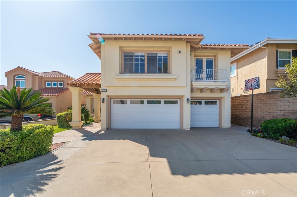 Welcome to 2141 Palermo – A Dream Home in Tustin Ranch. Nestled on an oversized lot in the prestigious Almeria community, this beautifully upgraded residence offers the perfect balance of elegance, comfort, and functionality. Featuring four spacious bedrooms, including a main-floor en-suite ideal for guests or multi-generational living, three and a half bathrooms, and a versatile upstairs bonus room, this home is designed for modern lifestyles. The grand living room impresses with soaring two-story ceilings and expansive windows, while the formal dining room opens seamlessly to the backyard. A gourmet kitchen awaits with quartz countertops, high-end stainless steel appliances, dual ovens, and a sunlit breakfast nook. The inviting family room includes built-ins, a cozy fireplace, and a wet bar—perfect for entertaining. Upstairs, the luxurious master suite boasts a vaulted ceiling, sitting area, fireplace, dual vanities, a walk-in shower, soaking tub, and a custom walk-in closet. Step outside to an expansive backyard with a large patio, lush lawn, charming gazebo, and storage shed. Energy-efficient upgrades include a paid solar system and fresh interior paint. Additional highlights include an indoor laundry room with built-ins and a three-car garage with epoxy floors and storage. Located within walking distance to award-winning Tustin Unified schools and just minutes from parks, golf, shopping, and major freeways, 2141 Palermo is the ultimate Southern California retreat.