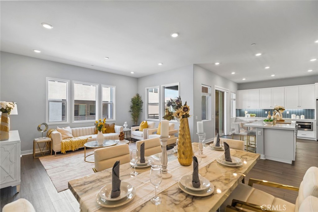 Built in 2023, this contemporary 4-bedroom, 3.5-bath condominium is set within a desirable guard-gated community featuring a luxury clubhouse. The open floor plan showcases a spacious great room, dining area, and chef’s kitchen with quartz countertops, custom backsplash, stainless steel appliances, a large center island, and a walk-in pantry—perfect for everyday living and entertaining. From the kitchen, two sliding doors open to a generous balcony, creating an inviting outdoor space where you can sit back and relax.
The first floor includes a private bedroom with its own full bathroom, ideal for in-laws, guests, or rental use. Upstairs, the primary suite offers a comfortable layout with dual vanities and a walk-in closet, while the additional bedrooms provide versatility for family or home office needs.
Other highlights include recessed lighting, a washer and dryer, direct-access 2-car garage, and premium finishes throughout. A private rooftop deck expands the outdoor living experience—perfect for barbecues, gatherings, or enjoying city fireworks.
Conveniently located near Costco, Asian markets, a variety of restaurants, Montebello Mall, and with easy freeway access to Downtown LA, this home combines modern design, comfort, and secure luxury living.
