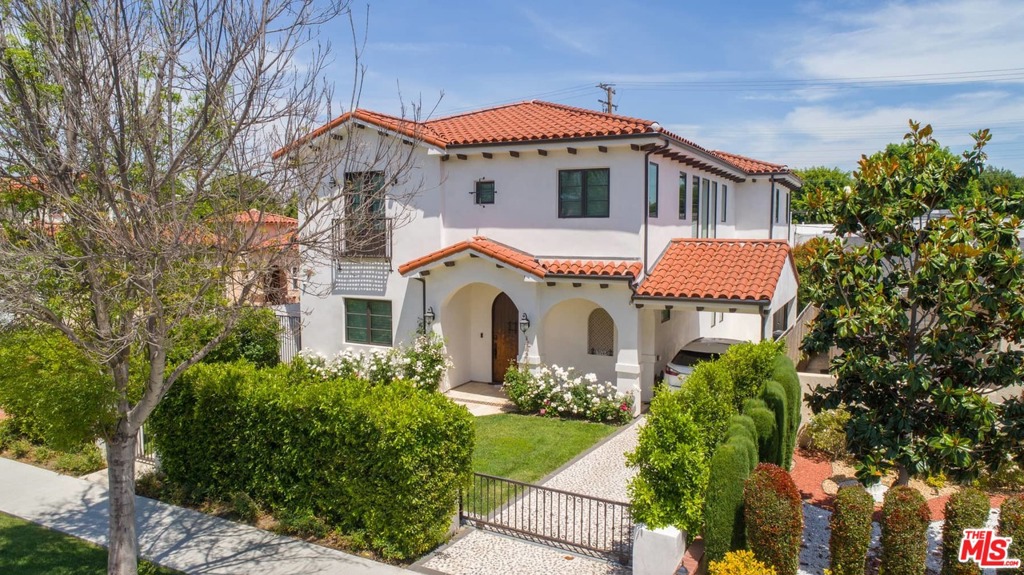 Almost brand new exceptional gated Mediterranean Villa with custom high-end finishes. Exquisite formal living room and dining room with adjacent large butler's area fully equipped with custom-made cabinetry and wine cellar. Amazing open floor plan-perfect for entertaining-Family room with fireplace and Grand Kitchen with large center island, French doors to the entertainers' backyard with a sparkling pool & spa. Chef's gourmet kitchen with extravagant custom designed finishes & high-end professional appliances & walk-in pantry. First floor also features an office with full bathroom/5th bedroom, a separate powder room. The second-floor features 4 bedroom suites including a luxurious master suite w/ an incredible walk-in closet, fireplace & a spa-like master bath, relaxing bath tub & a spacious balcony. Specious laundry room w/ side by side washer & dryer, sink and plentiful cabinetry also on the second level. Great quiet street, Walking distance to Rodeo Drive.