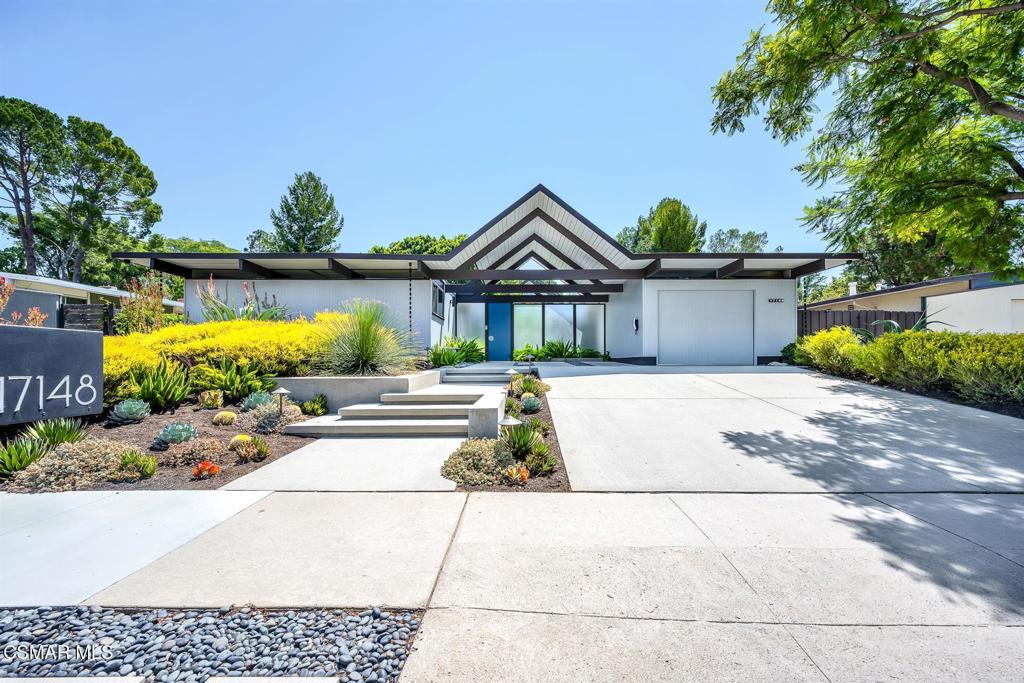Purchased from its original owner in 2017, this A. Quincy Jones A-frame was thoughtfully updated for modern living while taking meticulous care to preserve and restore many of its original Eichler features. Behind the iconic post-and-beam design, every detail has been elevated through a comprehensive renovation, replacing all major systems, including the plumbing, electrical, HVAC, and insulated cool roof. Walls of glass, Fleetwood sliders, and Milgard windows frame the signature indoor-outdoor lifestyle, with cork flooring, mahogany walls, custom cabinetry, and period-inspired lighting that honor the home's mid-century roots. The kitchen and baths were reimagined with Heath & Ann Sacks tile, Silestone surfaces, Bosch appliances, Dornbracht fixtures, and a steam shower--melding timeless aesthetics with modern function. Comfort & efficiency come from an owned solar power system, whole house water filtration & softener, induction cooktop, variable-speed pool equipment, automated atrium shade sail, hardwired security cameras, and Smart home connectivity throughout. Mature, drought-tolerant landscaping, Pebble Tech saltwater pool & spa, and a koi pond create a private, serene backyard sanctuary. With its blend of authentic Eichler character and extensive structural, mechanical, and aesthetic upgrades, this home offers a rare opportunity to own a true architectural treasure built to last in Granada Hills.