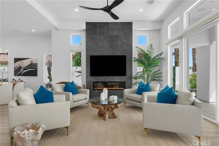 YOU HAVE TO SEE THIS REMODELED GEM!!  Welcome to this light, bright and recently remodeled Ocotillo 2, at beautiful Indian Ridge Country Club.  This 4-bedroom home, including an attached casita, boasts an open-concept layout with panoramic mountain views, overlooking double fairways on hole 11 of the Arroyo Course.  Each bedroom includes its own en-suite bath, creating privacy for family and guests.  Enjoy quiet mornings watching the beautiful sunrise creep up over the mountains, casting a fire-like glow on the patio, redone with porcelain pavers, a sparkling salt water pool with newer pebble tec, a spa, and built-in BBQ.  Wind down after a day of pickleball or golf by your modern firepit, perfect for relaxing evenings with a glass of wine or for entertaining guests.  Inside you’ll find luxury vinyl plank flooring flowing seamlessly throughout the home, 6” modern baseboards, electric shades, and new recessed lighting.  The floor to ceiling fireplace elevates the living room with a sense of modern luxury.  The chef’s kitchen is sure to impress, with a large center island, beautiful quartzite countertops, two sinks, Rohl faucets, a microwave drawer, sub-zero refrigerator, Wolf double ovens and a Wolf 6-burner stove (red knobs available)!  Large walk-in pantry offers plenty of storage, and a full size Thermador wine refrigerator will showcase your favorite bottles of wine.  The very spacious primary suite includes double opening shutters, a walk-in closet with a center island for shoe storage, and a spacious bathroom, with a large shower, two shower heads, two separate vanities, and a soaking tub.  Pavers enhance the curb appeal, showcasing colorful desert landscaping and newer turf. You’ll find epoxy flooring in the two-car plus golf cart garage, one newer water heater, and 2 new A/C in October 2025.  Top all of this off with owned solar panels, and you have your own desert oasis, ready to move-in and enjoy the start of the season.  Indian Ridge Country Club, offers resort-style amenities, including two Arnold Palmer golf courses, a state-of-the-art fitness center, saunas, spa, salon, tennis courts, pickleball courts, bocce, restaurants, and numerous activities.  Club Membership available with this home.