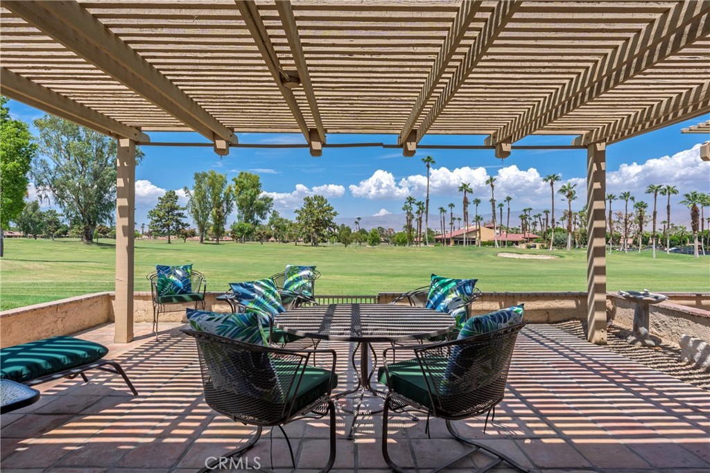 Discover this beautifully upgraded single-story end unit home with lots of privacy on the 7th fairway. Enjoy the view of the golf course and mountains as you relax on the huge north facing patio which includes a 10-piece patio set with brand new cushions. The included BBQ has a direct gas line – so no more propane tanks! Step inside to an open concept design featuring new Shaker style kitchen cabinets, and quartz countertops which seamlessly flow into the dining space. The wide plank luxury vinyl flooring adds warmth and durability, complemented by fresh paint, new recessed lighting in the kitchen, and an inviting quartz surround fireplace with a new mantle.
Unwind in the large primary suite, complete with a walk-in closet and vaulted ceilings. The ensuite bath with walk in shower has a new shower door.
New ceiling fans throughout ensure comfort, while the newer HVAC system provides efficiency. The new Nest thermostat allows you to control the temperature from your phone no matter where you are. The 2nd bedroom is ideal for guests or a home office, and the hall bath has a laundry area with brand new washer and dryer.
A garage workbench and storage cabinets add practicality, along with a golf cart with brand new batteries and featuring a water-cooling system for cruising around the community. Golf carts can also be driven outside the complex to the nearby shopping centers with a variety of stores and restaurants.
Woodhaven Country Club residents benefit from exclusive amenities, including a clubhouse with a restaurant and bar featuring live entertainment on the weekends, a well-equipped gym, premium cable T.V. & internet, a card room, a library, and an 18-hole golf course with reduced fees for residents, a pro shop, snack bar, driving range and putting greens. There are so many things to do – from lawn games to card games to karaoke to a docu-flix group that finds incredible films to watch together. Outside the clubhouse area are 7 tennis courts, 4 pickleball courts, and 4 pools and spas located at the 4 corners of the complex.
Don't miss this incredible opportunity to own a home in one of Palm Desert’s premier golf communities! This is easy living at its finest.