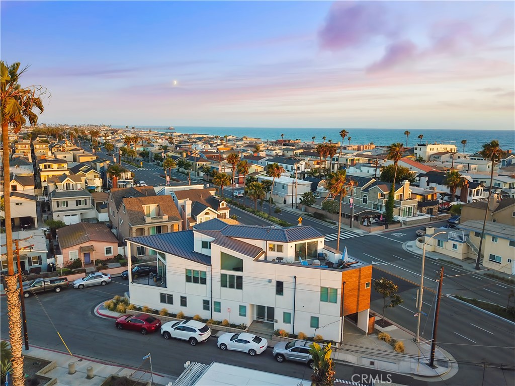 A Coastal Gem with Exceptional Value and Elegance on the Balboa Peninsula
Nestled just a gentle sea breeze from the beach and built in 2017, this magnificent Newport Beach property offers not only an impeccable coastal lifestyle but also the financial flexibility of a transferable "Newport Beach SHORT-TERM RENTAL PERMIT". Whether for personal enjoyment or rental income, this rare feature enhances its appeal.
A beacon of coastal elegance, this Balboa Peninsula treasure spans three levels, offering expansive living spaces infused with high-end luxury. Fully furnished and turnkey, the home boasts three spacious bedrooms, a versatile loft, and three sophisticated bathrooms. Every corner is meticulously crafted to ensure both beauty and functionality.
Soaring vaulted ceilings and grand windows bathe the interiors in radiant California sunshine, while wide-plank white oak floors and contemporary touches like stainless steel cable railings and stylish pendant lighting create a modern, inviting retreat.
The chef’s kitchen is a showstopper, featuring pristine quartz countertops, a large entertainment-ready island, sleek European cabinetry, and premium stainless-steel appliances. The open-plan living areas flow effortlessly, perfect for daily living and hosting.
The primary suite is a private oasis designed for relaxation, with a spa-inspired bathroom, walk-in shower, soaking tub, and spacious walk-in closet.
Outdoors, the rooftop terrace steals the show, offering panoramic views from coastline to skyline. It's ideal for sunset gatherings or quiet reflection and ready for a hot tub addition.
Built with sustainability in mind, the home features fully paid-off solar panels (2018), recessed lighting, central heating/air conditioning, and a built-in wine refrigerator.
Parking is convenient with a single-car garage and additional covered space. Located a block from the beach and within walking distance to fine dining, premier shopping, and vibrant beachside activities, this home offers not just a residence, but a sophisticated lifestyle of leisure and luxury.
Thank you for considering this extraordinary turnkey coastal sanctuary.