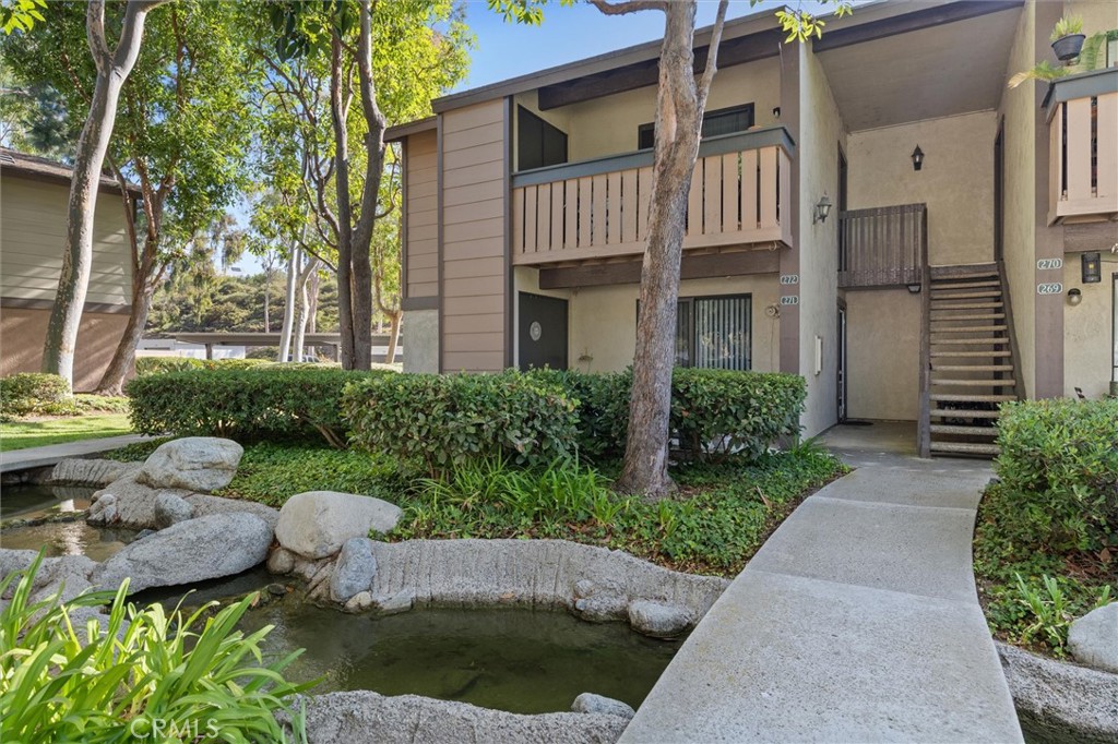 First-Time Home Buyer Opportunity! Move-in ready lower-level condo with resort-style amenities offering modern serenity in Lake Forest. Welcome to your ideal Lake Forest retreat — a cozy, affordable, and nicely remodeled home that combines comfort with the peaceful sounds of nature. Located in the desirable Pheasant Creek community, this 1-bedroom, 1-bath condo sits just steps from the pool and features an open-concept layout that blends the living and dining areas. The interior includes fresh paint and an updated kitchen with quartz countertops, sleek cabinetry, and stainless-steel appliances, creating a clean, modern feel. The spacious bedroom offers a walk-in closet, and the upgraded bathroom includes stylish finishes and quality fixtures. A private front patio provides a relaxing spot surrounded by lush landscaping and tranquil streams flowing through the community. Residents enjoy multiple pools and spas, tennis courts, and scenic walking paths. The home includes a full-size washer and dryer, a covered carport, and one additional parking space. HOA dues cover water, trash, and exterior maintenance for a low-maintenance lifestyle. Pheasant Creek is an FHA-approved complex, conveniently located near parks, shops, restaurants, and with easy access to freeways and toll roads. Won't Last Long!