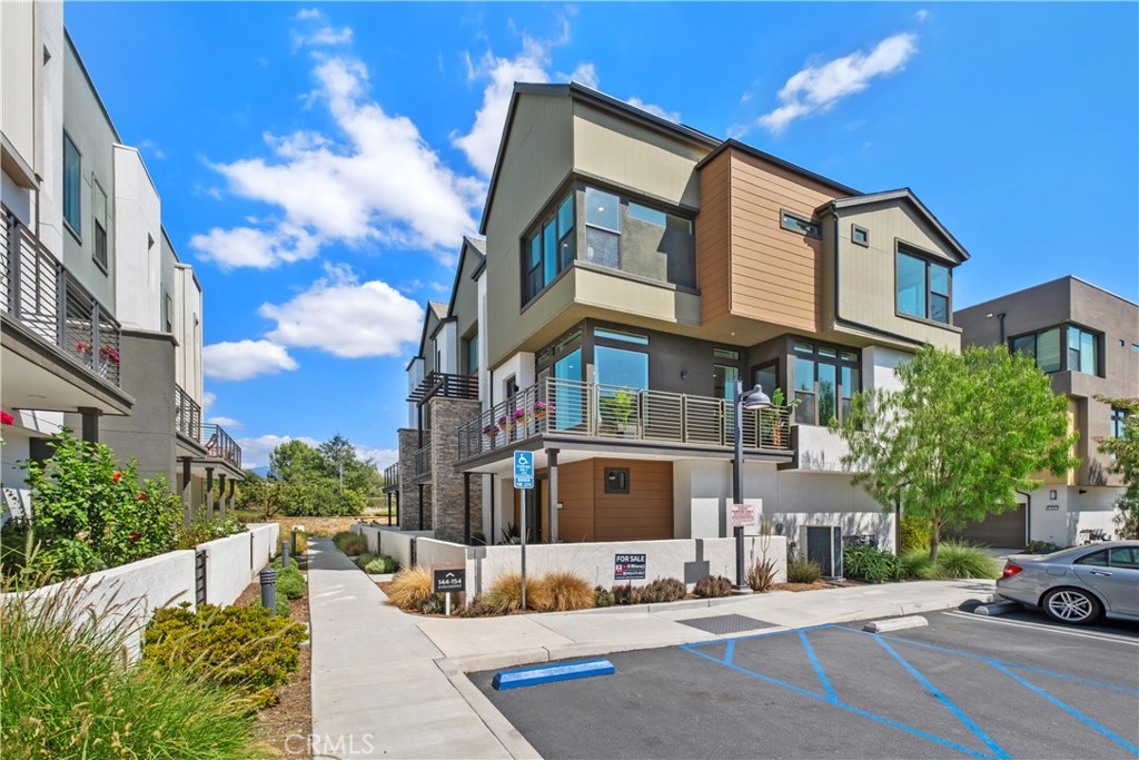 Like-New Luxury Upgraded Turnkey End-Unit Residence in Irvine Great Park Neighborhood–Exceptional Value! Just Minutes’ Walk to top-rated Portola High School and Solis Park School (K–8) in the award-winning Irvine Unified School District—daily drop-offs are skipped, making life a true breeze for parents. 3 beds, 2.5 baths, and 1,812 sqft of living space. Premium End Unit boasts superior natural light, enhanced privacy, a quieter setting, a larger front yard, and an L-shaped deck. The expansive Open-Concept Layout seamlessly connects the kitchen, living, and dining areas, enhanced by 10-foot ceilings to create a harmonious flow of space. Oversized windows paired with floor-to-ceiling doors bathe the interiors in abundant natural light, accentuating the home’s spacious design and luxurious appeal. Tasteful upgrades include whole-house hardwood flooring, whole-house water softening system, and elegant chandeliers. Stunning primary bedroom suite features a walk-in closet, dual vanity, and a walk-in shower. Two secondary bedrooms are generously sized too. The first floor offers ample storage closets and direct access to a side-by-side 2-car garage. Energy-saving features include leased solar system, EV charger pre-wire, energy-efficient windows,and tankless water heater. Just minutes from Woodbury Town Center, Irvine Spectrum Center, and Kaiser Permanente, etc. Enjoy Great Park’s world-class recreational amenities and the state-of-the-art sports complex, with easy access to I-5, 133, 405, and 241. Only 18–25 minutes’ drive to Newport Beach and Laguna Beach.