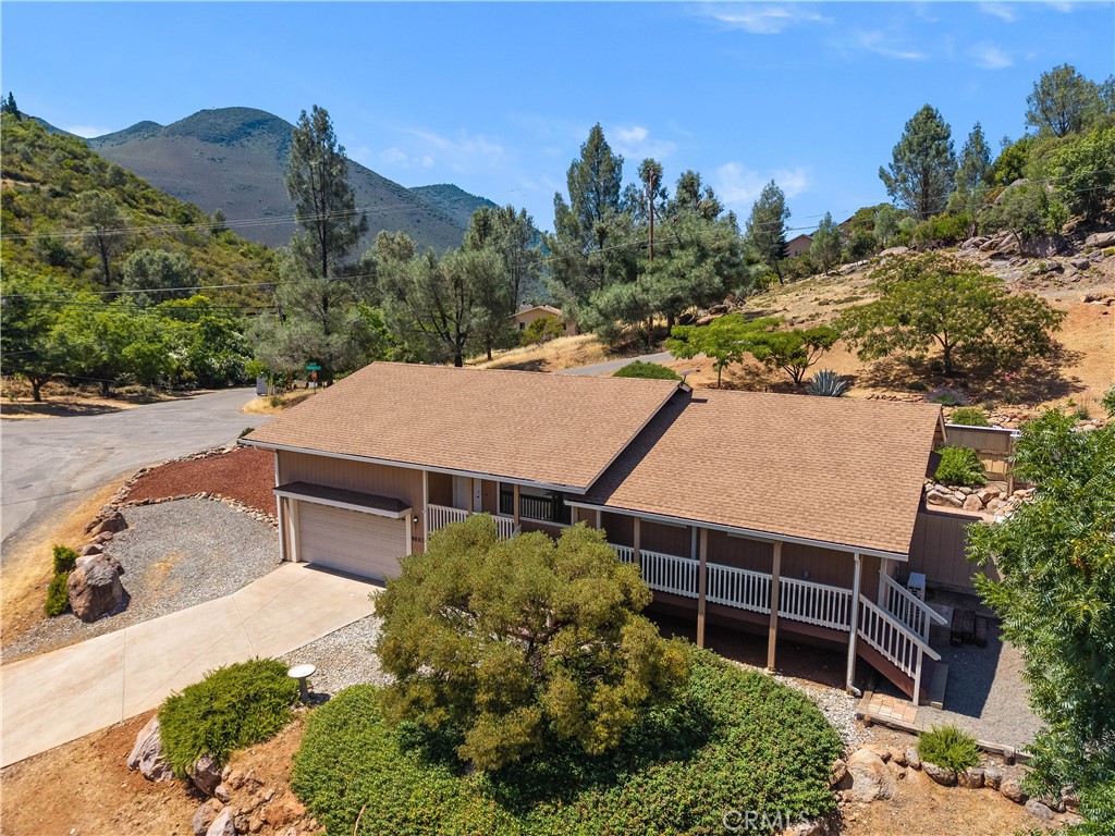 Peaceful and pretty in Kelseyville Riviera. Beautiful touches throughout this 2-bedroom, PLUS office, 2-bathroom home on over a half-acre. Formal entry and living room with oak hardwood flooring and stylish built-in shelving and barn door. Sunny kitchen with updated appliances, tile backsplash and breakfast bar are open to the dining area with bay windows. Primary bedroom with double sink vanity and large walk-in closet. Guest bedroom & bath plus office that could easily be used as a third bedroom. Energy efficient ductless heat and air, indoor laundry room and canned lighting throughout. Kick back on the covered front porch or entertain out back on the stone patio surrounded by mature plants. Fenced and private backyard. Attached two car finished garage with workshop and extra storage space. Close to shopping, restaurants, the lake and just minutes to charming downtown Kelseyville. This well maintained and thoughtfully updated home is an opportunity to a lake and wine country lifestyle.