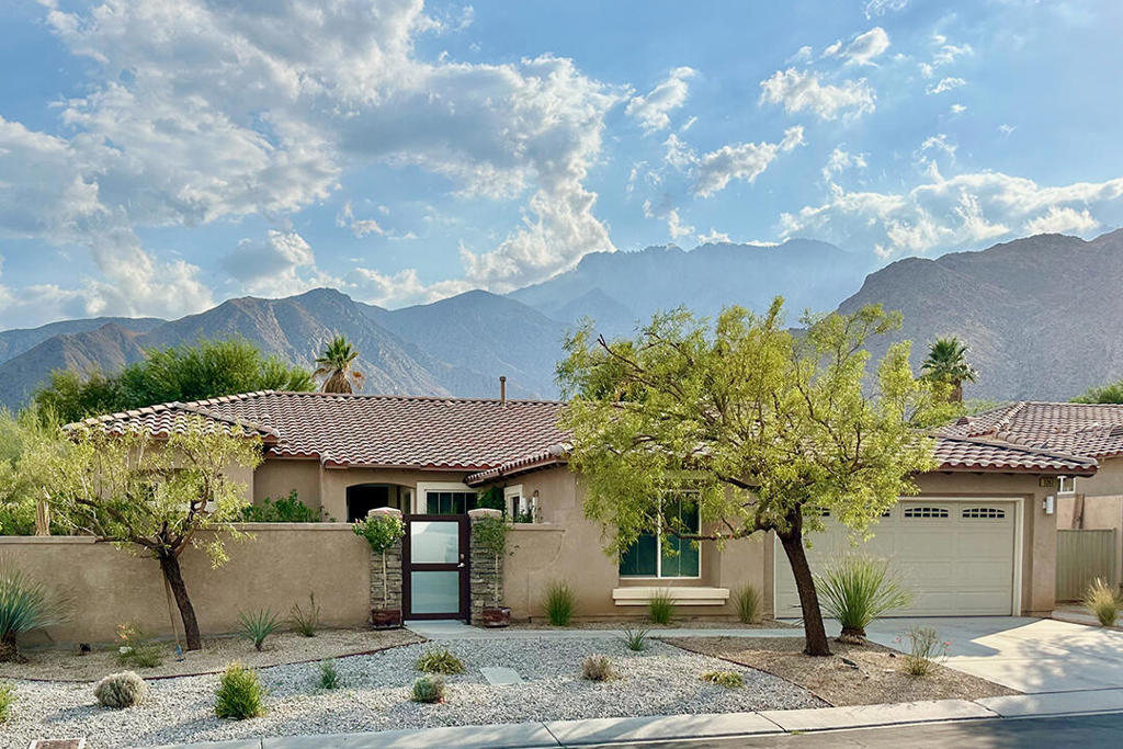 This beautiful Bella Floor Plan home completed in 2014 features a full array of builder upgrades. From the pool with a raised spa, to the private front courtyard, nothing has been overlooked.Inside you'll find an open floor plan with gorgeous, contemporary kitchen with two prep islands, a dining area, and a stainless steel appliance package. The living room and dining areas are ideal for entertaining with easy access to both the front patio and backyard with mountain views. The new CV Link bike path winds through the generous green space that is beyond the backyard, framed with vibrant and mature trees.The Bella features an extra-large primary suite along one side of the home with ample space to accommodate a sitting area or office. It has backyard access, views, a spa-like bath, and a generous walk-in closet. On the opposite side of the home are two additional bedrooms. One of the additional bedrooms has backyard access, and both bedrooms are connected by a shared ''Jack and Jill'' bath. This side of the home also has a guest half-bath, the laundry room, and access to the two-car garage. The fourth bedroom is the casita with an ensuite bath; it is accessible from the front courtyard.Other amenities include a recently installed, owned solar system with Tesla battery backup, and an Alumiwood pergola along the back of the home. Inside, the entire house has been freshly painted, and new carpet installed in the three interior bedrooms. Builder upgrades include high-end tile flooring, modern kitchen cabinets with tile backsplash and quartz counters, and upgraded baths, as well as a stucco block-wall enclosure around the front patio. This home is in immaculate condition, and its fresh styling makes it stand out from the older homes in the community.