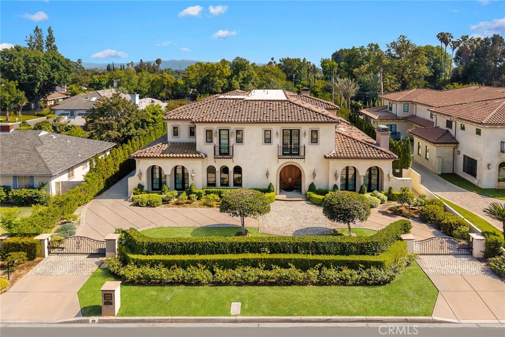 Welcome to this magnificent Italian estate, designed by renowned architect Robert Tong, nestled in the heart of Arcadia. This luxurious home features 6 bedrooms, 8 bathrooms and a 4-cars garage, all set on a 21,300 SF premium lot. Architectural masterpiece of modern luxury and comfortable living. When you stepped through the double doors entrance leads to the grand foyer with an enormous crystal chandelier. The high celling hall and modern style design allow you and your family to experience a luxurious lifestyle. Stylish touches include dark wood & inlaid marble floors and designer-select lighting fixtures. Downstair complete with a formal living room, a formal dining room, a junior master bedroom, a home office library, a home theater, Private elevator, a fitness Gym offer both sauna and bath, Chef's kitchen with top-of-line appliances and an adjacent wok kitchen, a game room with wine cellar. The upper level showcases a remarkable master suite. A sitting area with private office and spacious balcony. dual walk-in closets. a stunning master bath with double Sinkes, separate soaking tub and double wide shower. Step outside to your back yard, the beautifully landscaped garden, a spectacular patio with a fireplace. The resort inspired pool and spa gracefully compete the outdoor entertaining area. The house located within the award-winning Arcadia Unified School District and close to shopping, dining, golf courses, LA County Arboretum, Santa Anita racetrack. Schedule a private tour today to experience this remarkable estate for yourself.