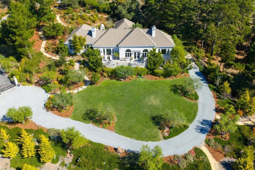 Framed by views of Point Lobos, this lovingly remodeled Italian villa rests gracefully behind an elegant gate on 8 acres of exquisitely landscaped grounds where every day feels like a stroll through the Mediterranean! Offering over 4,500 sq ft of refined single level living, the residence features 6 bedrooms, 5.5 bathrooms, and an inviting guest quarters perfect for entertaining with ease and elegance. Expansive windows capture ocean vistas, while the sophisticated library, 3 fireplaces, and thoughtfully designed interiors evoke timeless European charm. The grounds are lush- every pathway and garden corner reveals a new vignette: serene seating areas, meandering trails, and your own olive orchard sustained by a private well. Multiple outdoor rooms invite relaxation and gathering. At the heart of it all lies a grand ocean-view terrace. Here, endless entertaining unfolds cocktails at sunset, intimate dinners al fresco, or elegant gatherings. Across the acreage, additional outdoor spaces are thoughtfully placed to maximize both privacy and views. Nestled in complete serenity, yet only minutes from the world-class dining, art, and boutiques of Carmel-by-the-Sea, this estate harmoniously blends privacy, luxury, and proximity to one of California's most sought-after coastal enclaves.