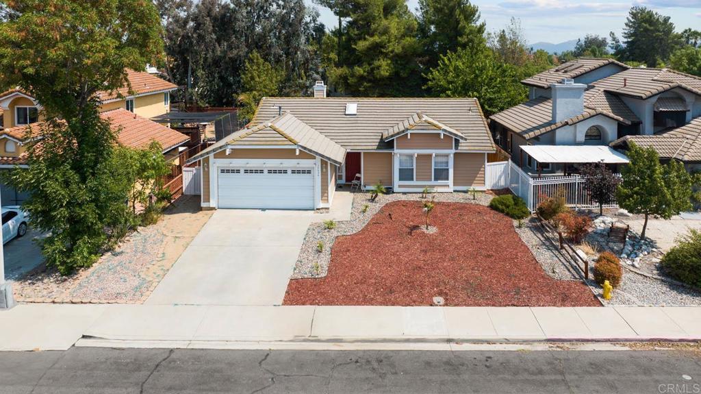 Welcome to 39938 Pearl Dr — a beautifully maintained single-family home nestled in a quiet, family-friendly neighborhood. Featuring 3 spacious bedrooms, 2 full bathrooms, and over 1,200 square feet of well-designed living space, this home is perfect for first-time buyers, young families, or anyone seeking comfort and convenience. Step inside to an inviting open-concept layout that seamlessly connects the living room, dining area, and modern kitchen. You'll love the stylish cabinetry, clean finishes, and natural light that fills the space—making it ideal for everyday living and entertaining. Each bedroom offers generous space and a cozy atmosphere, perfect for relaxation and privacy. Sitting on a large 7,405 sq. ft. lot, the backyard provides plenty of room for outdoor fun, gardening, or future expansion. Whether you’re hosting weekend barbecues or enjoying a peaceful evening under the stars, this backyard has it all. Located in a peaceful Murrieta community known for its excellent schools, parks, and amenities, this home offers the perfect blend of tranquility and convenience. Don't miss your chance to make this gem your own—schedule your private tour today!