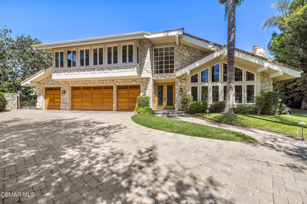Experience the ultimate in privacy and elegance with this exceptional North Ranch estate, perfectly situated adjacent to the prestigious North Ranch Golf Course. Enter through private gates and follow a long, tree-lined driveway to your secluded retreat on over half an acre of beautifully landscaped grounds.The expansive property offers a sparkling pool and spa with a safety fence, a large grassy area, a side yard with basketball hoop, and an oversized driveway providing ample parking.Inside, you'll find five bedrooms and five baths, including a luxurious primary suite with vaulted wood plank ceilings, a cozy fireplace, and a private balcony overlooking the backyard and golf course. The en suite bathroom features a soaking tub, separate shower, dual-sink vanity, and two spacious walk-in closets.Designed for both comfort and entertaining, the home offers expansive living areas filled with natural light. The living room boasts soaring wood-beam ceilings and dramatic floor-to-ceiling windows. A downstairs office with its own en suite bathroom provides the perfect space for work or guests.The gourmet kitchen features a large center island, granite countertops, custom hardwood cabinetry, built-in refrigerator, and high-end stainless steel appliances. It seamlessly flows into the spacious family room, where you'll find a cozy fireplace, a fully equipped bar, and picturesque views of the rear yard.Additional highlights include a finished four-car garage with built-in storage and direct access to the home.Step outside to your backyard oasis featuring a huge covered patio, built-in BBQ, expansive lawn, and sparkling pool and spa--the perfect setting for both entertaining and relaxation.Located in the prestigious North Ranch community of Westlake Village, this home offers convenient access to upscale shopping, dining, and award-winning schools: Westlake Hills Elementary, Colina Middle School, and Westlake High School.This custom estate combines privacy, luxury amenities, and a premier location, making it an extraordinary lease opportunity.