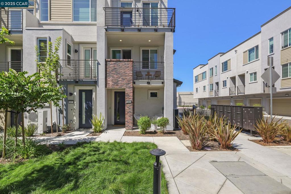 Experience modern living at its finest in this 2023-built townhome-style condo located in Alameda’s sought-after Bay37 community. This 2BD/1.5BA home offers approximately 1,000 sq. ft. of bright, open space designed for comfort and functionality. The entry level features an attached 1-car garage, convenient powder room, and extra storage. Upstairs, enjoy a sleek chef’s kitchen, open dining area, and spacious living room that extends to a private balcony—ideal for morning coffee or evening relaxation. The top floor offers two sunny bedrooms, with one offering its own balcony for added privacy and outdoor enjoyment. This home is thoughtfully equipped with smart-home technology, A/C, dual-zone heating, owned solar and energy-efficient systems throughout. The location is unmatched—steps from the Alameda waterfront with a free ferry to Jack London Square every 30 minutes and two additional SF Bay Ferry routes about a mile away, making your San Francisco commute simple and affordable. Walk to Target, Safeway, In-N-Out, restaurants, and cafés at Alameda Landing. Bay37 also features a public park, picnic areas, playground, dock, and scenic waterfront trails. Enjoy the perfect balance of style, convenience, and vibrant community living in this exceptional home.