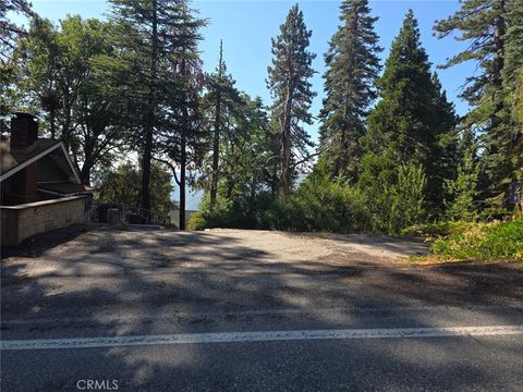 Photo of 30778 Live Oak Drive, Running Springs, CA 92382 (MLS # IV25164283)