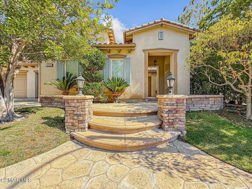 Nestled in one of Simi Valley's most coveted neighborhoods, this exceptionally beautiful 5-bedroom, 4.5-bath residence offers elegance, space, and the perfect balance of luxury and comfort. Boasting one of the most desirable floor plans in the community, this stunning home has been thoughtfully upgraded with travertine flooring, granite countertops, and classic wood plantation shutters throughout.The layout includes a downstairs bedroom and full bath, ideal for guests, a home office, or a playroom. The primary suite is a true retreat, featuring a spa-like bathroom with an oversized shower, a jacuzzi tub, and an expansive walk-in closet complete with a cozy sitting area--perfect for relaxing or getting ready in style.On the main level, enjoy an inviting formal living room with a fireplace, an elegant formal dining room, and a spacious family room that seamlessly flows into the heart of the home--a chef's kitchen like no other. Designed for both everyday living and entertaining, the kitchen boasts an oversized center island, stainless steel appliances, Thermador stovetop, double ovens, microwave, warming drawer, and dishwasher--all beautifully integrated into a wide-open layout.Step outside to your own private oasis: a charming courtyard with a sitting area, and a backyard adorned with fruit trees, lush landscaping, and ample space for BBQing and entertaining loved ones.Located in the hills of Simi Valley, the Winstone community offers peace, privacy, and access to scenic hiking trails and a nearby recreational park--all while being just minutes from shopping, dining, and freeway access.Homes like this don't come around often--this is luxury living at its finest. Don't miss your chance to own a slice of paradise in Big Sky!