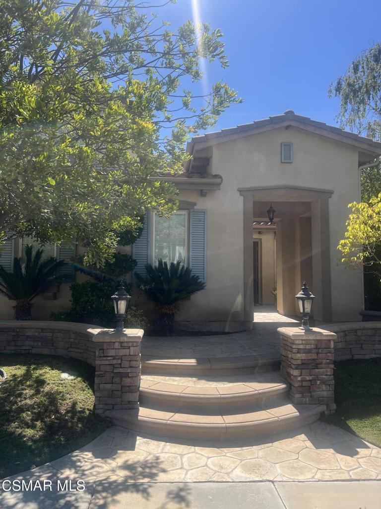 Nestled in one of Simi Valley's most coveted neighborhoods, this exceptionally beautiful 5-bedroom, 4.5-bath residence offers elegance, space, and the perfect balance of luxury and comfort. Boasting one of the most desirable floor plans in the community, this stunning home has been thoughtfully upgraded with travertine flooring, granite countertops, and classic wood plantation shutters throughout.The layout includes a downstairs bedroom and full bath, ideal for guests, a home office, or a playroom. The primary suite is a true retreat, featuring a spa-like bathroom with an oversized shower, a jacuzzi tub, and an expansive walk-in closet complete with a cozy sitting area--perfect for relaxing or getting ready in style.On the main level, enjoy an inviting formal living room with a fireplace, an elegant formal dining room, and a spacious family room that seamlessly flows into the heart of the home--a chef's kitchen like no other. Designed for both everyday living and entertaining, the kitchen boasts an oversized center island, stainless steel appliances, Thermador stovetop, double ovens, microwave, warming drawer, and dishwasher--all beautifully integrated into a wide-open layout.Step outside to your own private oasis: a charming courtyard with a sitting area, and a backyard adorned with fruit trees, lush landscaping, and ample space for BBQing and entertaining loved ones.Located in the hills of Simi Valley, the Winstone community offers peace, privacy, and access to scenic hiking trails and a nearby recreational park--all while being just minutes from shopping, dining, and freeway access.Homes like this don't come around often--this is luxury living at its finest. Don't miss your chance to own a slice of paradise in Big Sky!