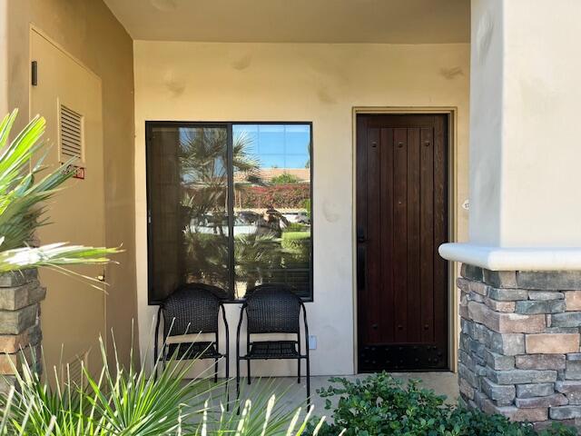 Discover the resort-style living of Casitas Las Rosas, ideally situated on the grounds of the Embassy Suites Hotel in the heart of beautiful downtown La Quinta. This lower- level one-bedroom, one-bath end unit offers open concept layout with a modern kitchen featuring granite countertops and stainless steel appliances. The spacious bedroom includes a walk-in closet, and there's an in-unit laundry for added convenience. Just steps away you'll find the community pool and spa perfect for relaxation and views. This property is an excellent investment opportunity, as it qualifies for La Quinta Short Term Rental permit and can be used as a short term rental. Enjoy a short stroll to Old Town La Quinta, where you'll discover charming shops, exquisite dining, and don't miss the Sunday Farmers Market. As an owner you also gain access to the Embassy Suites Hotels restaurant and bar conveniently located on- site. Experience world- renowned golf a PGA West, or the magical history of the La Quinta Resort as well as the excitement of Stagecoach and Coachella Music Festivals, just a short drive away. If tennis is your game the Indian Wells Tennis Center, home to the BNP Paribas Tennis Tournament, is nearby. This complex has the location and amenities for all to enjoy.This property is currently marketed for sale also.