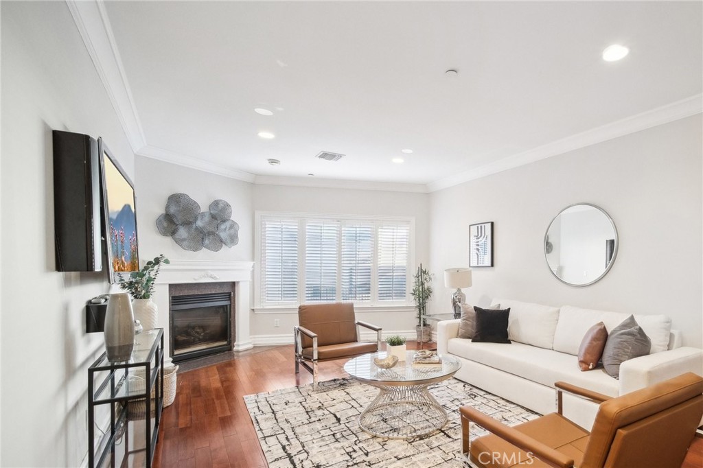 Proudly introducing this stunning 3-bedroom, 2.5-bathroom, 1,783 sq. ft. townhome-style condo located south of the Boulevard in the highly desirable Laurelwood Terrace community. This contemporary two-story gem boasts an expansive 1200 sq. ft. PRIVATE TERRACE DECK with breathtaking views of the Studio City hills, complete with rooftop patio outdoor BBQ island station, mini fridge, 2 retractable awnings, TV, and lighting—perfect for entertaining or relaxing under the California sun. Inside, you'll find three spacious bedrooms with newly installed flooring and each with their own french doors leading to the amazing terrace! A luxurious primary suite featuring a walk-in closet, a spa-like bathroom with a large soaking tub, granite finishes, travertine flooring, and a separate glass-enclosed shower. The galley style kitchen boasts stainless steel Bosch appliances, a breakfast nook, and a convenient built-in workstation. Spacious living room seamlessly blends into the dining room with great convenience! Unit has no neighbors above or below for extra privacy! Other great features include newer AC units, freshly painted throughout, added crown molding, recessed lighting, new light fixtures throughout, in-unit laundry for convenience, a water softener system and two side-by-side parking spaces, plus three guest parking spots. Community amenities include a sauna, weight room, unit's own large storage room and HOA services covering trash, water, building maintenance, and insurance. Located within walking distance of the shops and restaurants on Ventura Boulevard, this home is in the prestigious Carpenter Elementary School with a great school district. It’s also close to Radford Studio Center, where exciting redevelopment plans promise to boost the area's economic growth and property values!