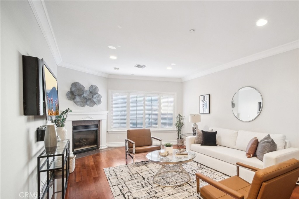 Proudly introducing this stunning 3-bedroom, 2.5-bathroom, 1,783 sq. ft. townhome-style condo located south of the Boulevard in the highly desirable Laurelwood Terrace community. This contemporary two-story gem boasts an expansive 1200 sq. ft. PRIVATE TERRACE DECK with breathtaking views of the Studio City hills, complete with rooftop patio outdoor BBQ island station, mini fridge, 2 retractable awnings, TV, and lighting—perfect for entertaining or relaxing under the California sun. Inside, you'll find three spacious bedrooms with newly installed flooring and each with their own french doors leading to the amazing terrace! A luxurious primary suite featuring a walk-in closet, a spa-like bathroom with a large soaking tub, granite finishes, travertine flooring, and a separate glass-enclosed shower. The galley style kitchen boasts stainless steel Bosch appliances, a breakfast nook, and a convenient built-in workstation. Spacious living room seamlessly blends into the dining room with great convenience! Unit has no neighbors above or below for extra privacy! Other great features include newer AC units, freshly painted throughout, added crown molding, recessed lighting, new light fixtures throughout, in-unit laundry for convenience, a water softener system and two side-by-side parking spaces, plus three guest parking spots. Community amenities include a sauna, weight room and unit's own large storage room. Located within walking distance of the shops and restaurants on Ventura Boulevard, this home is in the prestigious Carpenter Elementary School with a great school district.