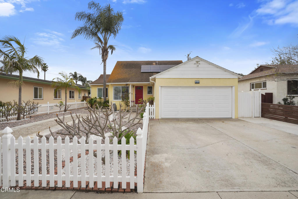 Tucked away on one of Midtown Ventura's most charming streets, 3180 Armada Drive blends timeless character with thoughtful modern upgrades. A white picket fence and welcoming red front door set the tone, leading into light-filled living and dining spaces that open to views of the lush front and back yards. The custom kitchen is a dream for both cooks and entertainers, with sleek refrigerator drawers, under-counter beverage fridges, a hidden dishwasher for extra counter space, and a walk-in pantry/coffee bar with another fridge and abundant pull-out storage.The versatile layout offers two bedrooms and a full bath on the main level, including a spacious back room reimagined as a private primary suite with an upgraded fireplace. The inviting family room features vaulted wood-beamed ceilings and a brick hearth that's been tastefully refreshed. Upstairs, two additional bedrooms and a full bath create a cozy retreat.Recent improvements include new windows, updated baths and fixtures, split-system AC/heat, a tankless water heater, owned solar, and a whole-home water softener with reverse osmosis. The backyard is ready for relaxing and entertaining with updated lighting, shade, and landscaping.Close to schools, parks, dining, the harbor, and Ventura's beaches. Potential for assumable VA loan. Contact listing agent for eligibility and terms.