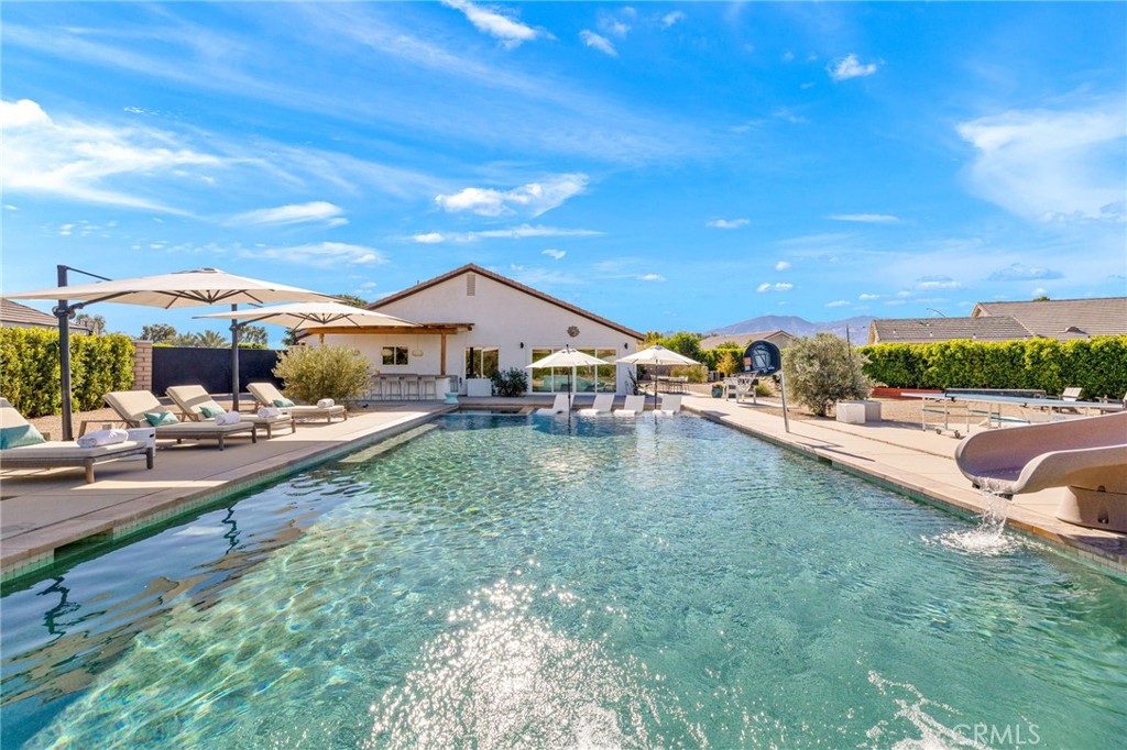Welcome to your own slice of desert paradise, fully furnished and STR-ready. This newly renovated property is a short-term rental standout, perfectly positioned near the Coachella Music Festival, casinos, and the tennis center. Designed for unforgettable stays and effortless hosting, this luxe 4-bedroom property offers vibrant indoor-outdoor living with every amenity guests love.
Step inside to an open-concept interior, where a sun-soaked kitchen, dining, and living area flow seamlessly to the entertainer’s backyard. The home’s thoughtful layout makes it both stylish and comfortable, with well-appointed bedrooms and a bonus private outdoor shower.
Outside, the private backyard is a full-on resort located on over 1/3 acre: pool with twisty slide and sports setup for volleyball and basketball, hot tub, built-in fire pit, outdoor bar and BBQ, alfresco dining, and with advanced sound and lighting. There's plenty of room to spread out in the sun or relax in the shade, making it ideal for families and groups of friends alike. Plus proven income with excellent guest appeal.
Whether you're looking for a high-performing rental, vacation getaway, or both—this is the desert escape that truly delivers fun, sun, and income. ADU plans available, and utilities prepped for your future casita-build!