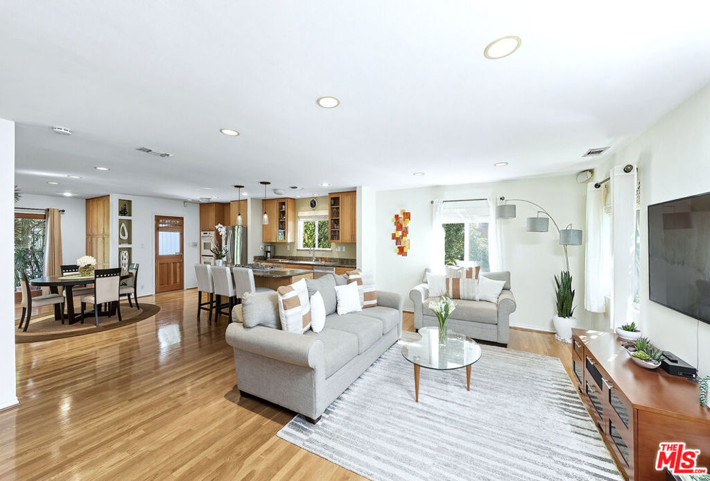 Welcome to your Mar Vista dream home! Perfectly located on the distinguishable Mar Vista Hill and within the highly sought-after Mar Vista Elementary school district, this stunning family residence combines thoughtful design with breathtaking views. From the living spaces, enjoy sweeping vistas of the city skyline, distant mountains, and even the iconic Hollywood sign. Inside, the spacious floor plan has been carefully crafted for both comfort and style, offering seamless flow between living, dining, and entertaining areas. Natural light fills every room, highlighting refined finishes and a warm, inviting atmosphere. Step outside to the beautifully landscaped backyard garden, a private oasis ideal for relaxation, play, or outdoor dining. This neighborhood puts everyday essentials and favorite bites right at your fingertips - Beethoven Market, Whole Foods, New York Bagel, Chipotle, Robeks Juice, Yama Sushi, The Hive, Avatar Nails, and Laisy Daisy Cafe are just a stone's throw away. From morning coffee runs to last-minute grocery trips and dinner out, everything you need is just around the corner. It's an easy, convenience-first lifestyle with dining, services, and shopping all close by - perfect for busy weekdays and relaxed weekends alike. The detached garage provides flexibility whether you envision it as secure parking, a home studio, creative workspace, or a possible ADU conversion. Blending serene retreat-like living with proximity to all the best of the Westside, this home offers a rare opportunity to experience Mar Vista at its finest.